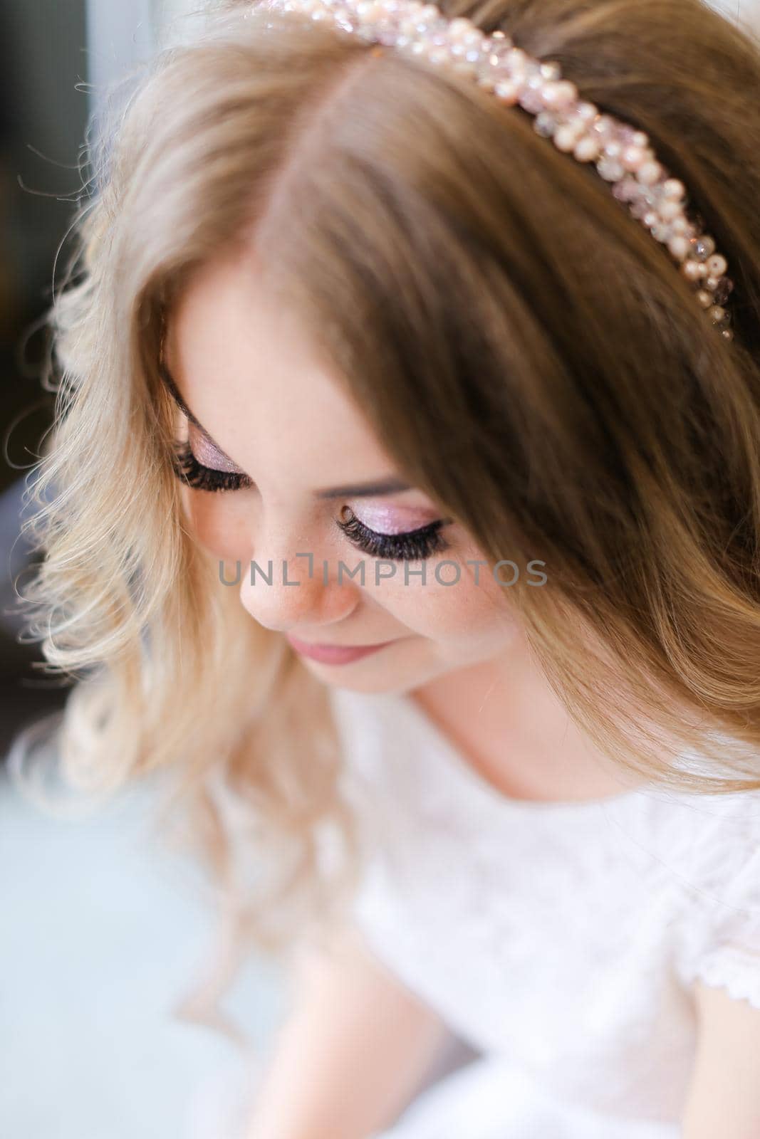 Portrait of nice bridal makeup and black cute eyelashes and diadem. by sisterspro