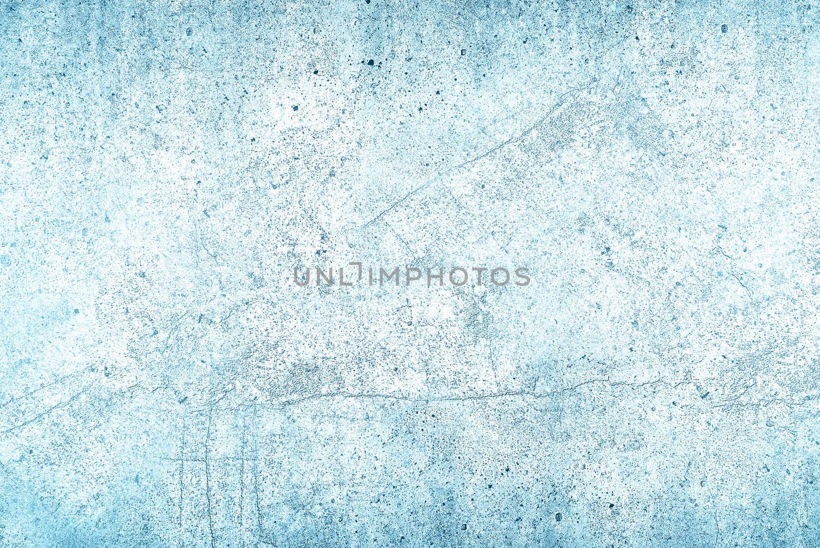 Grunge uneven light blue stone texture background with cracks and stains