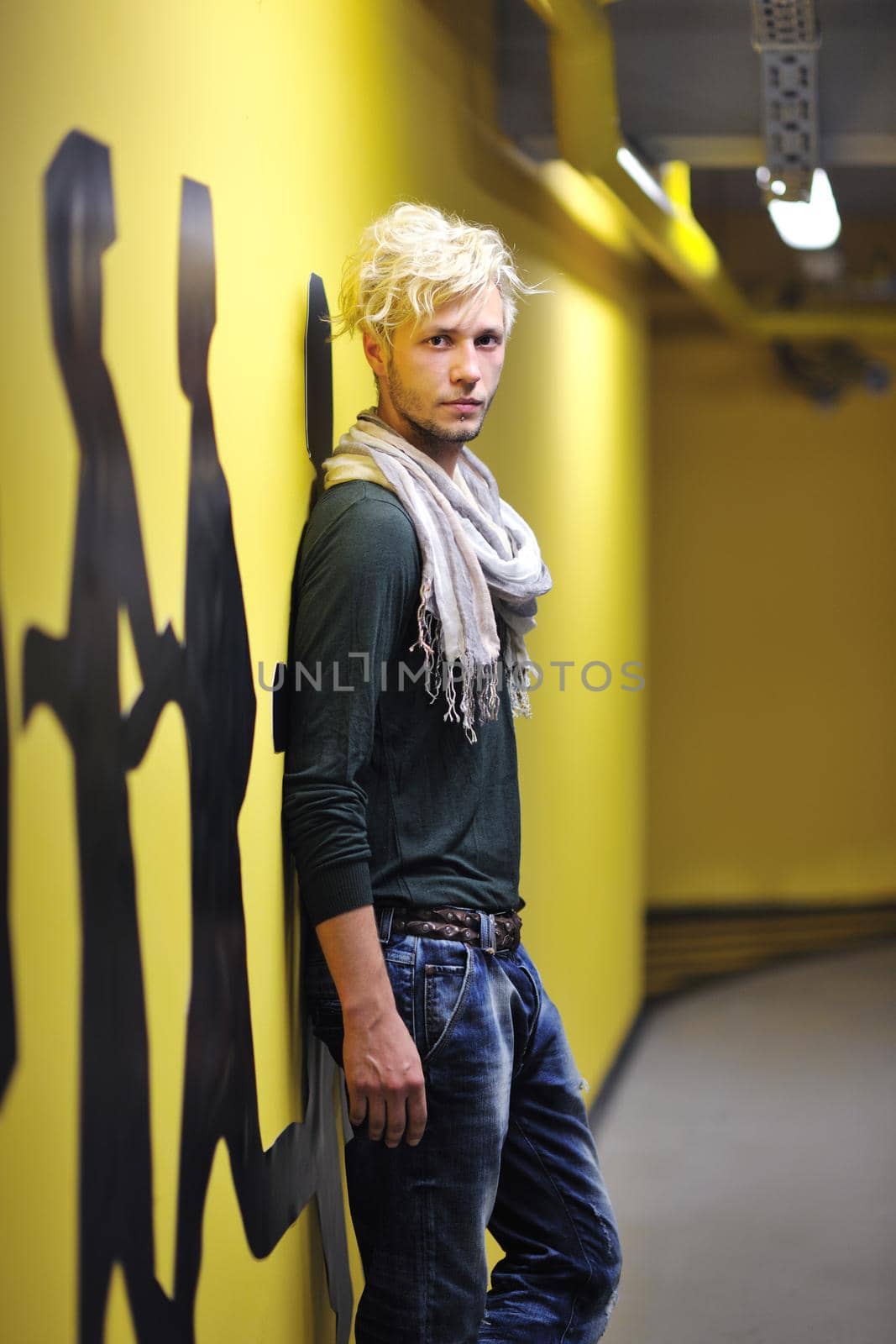 Portrait of an handsome young  man  with urban background and fashion clothes style