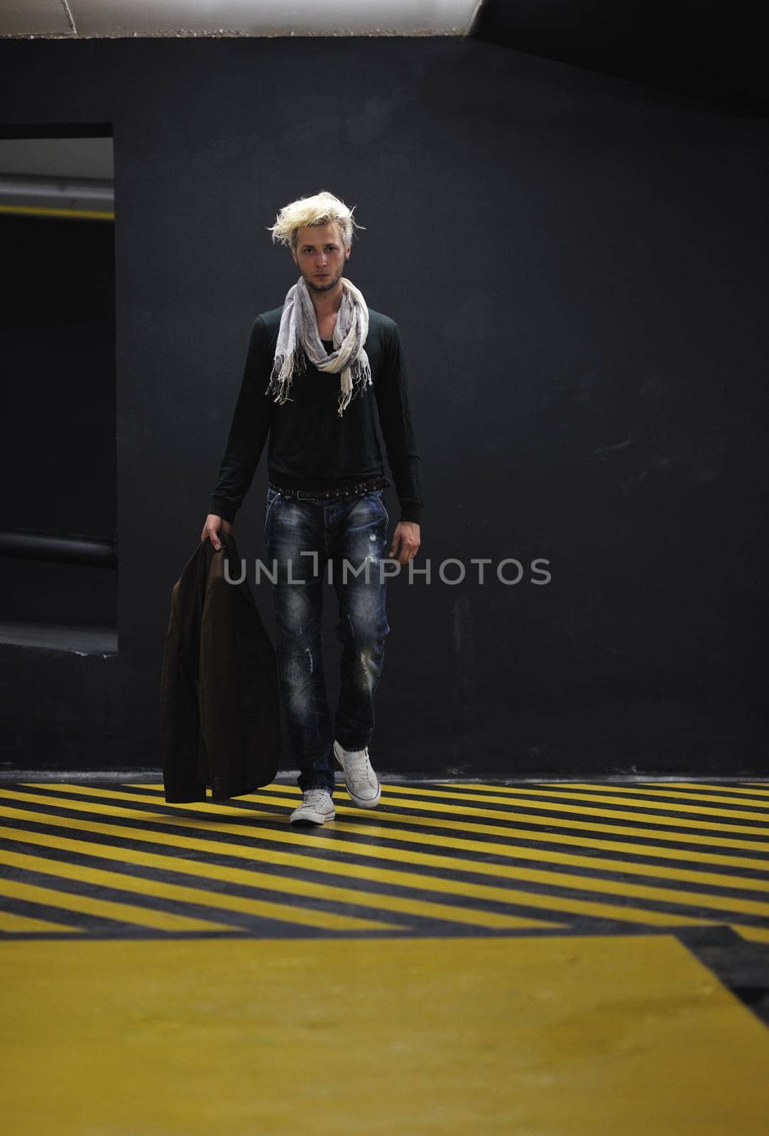 Portrait of an handsome young  man  with urban background and fashion clothes style