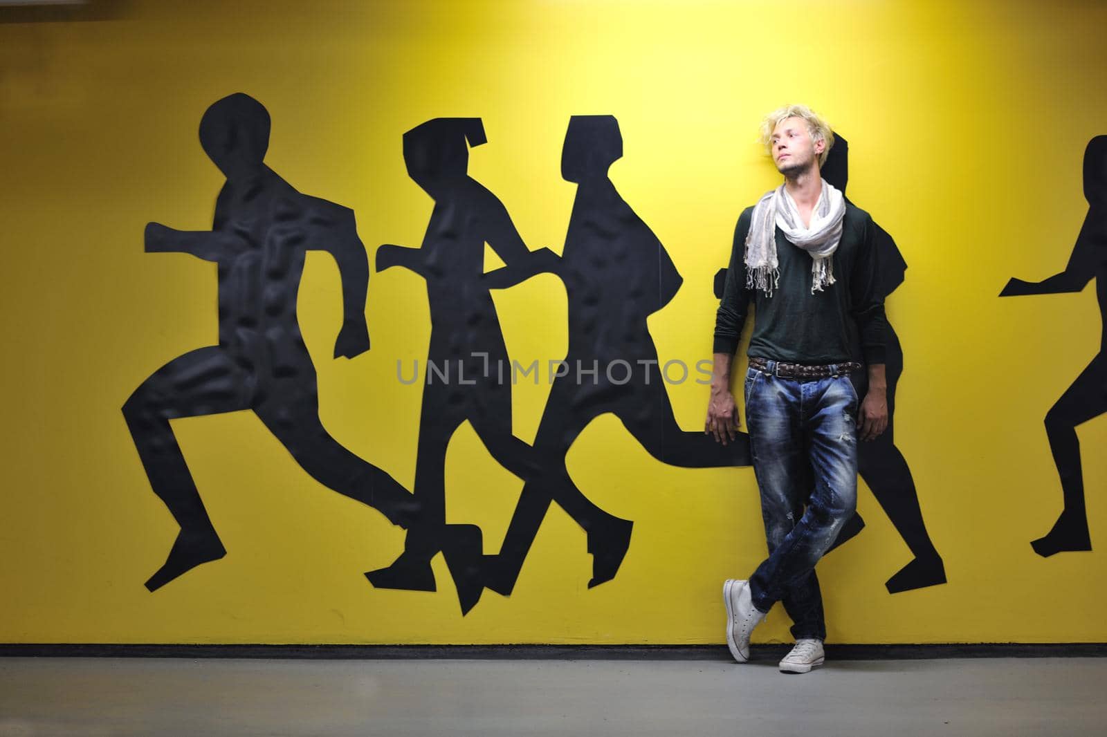 Portrait of an handsome young  man  with urban background and fashion clothes style