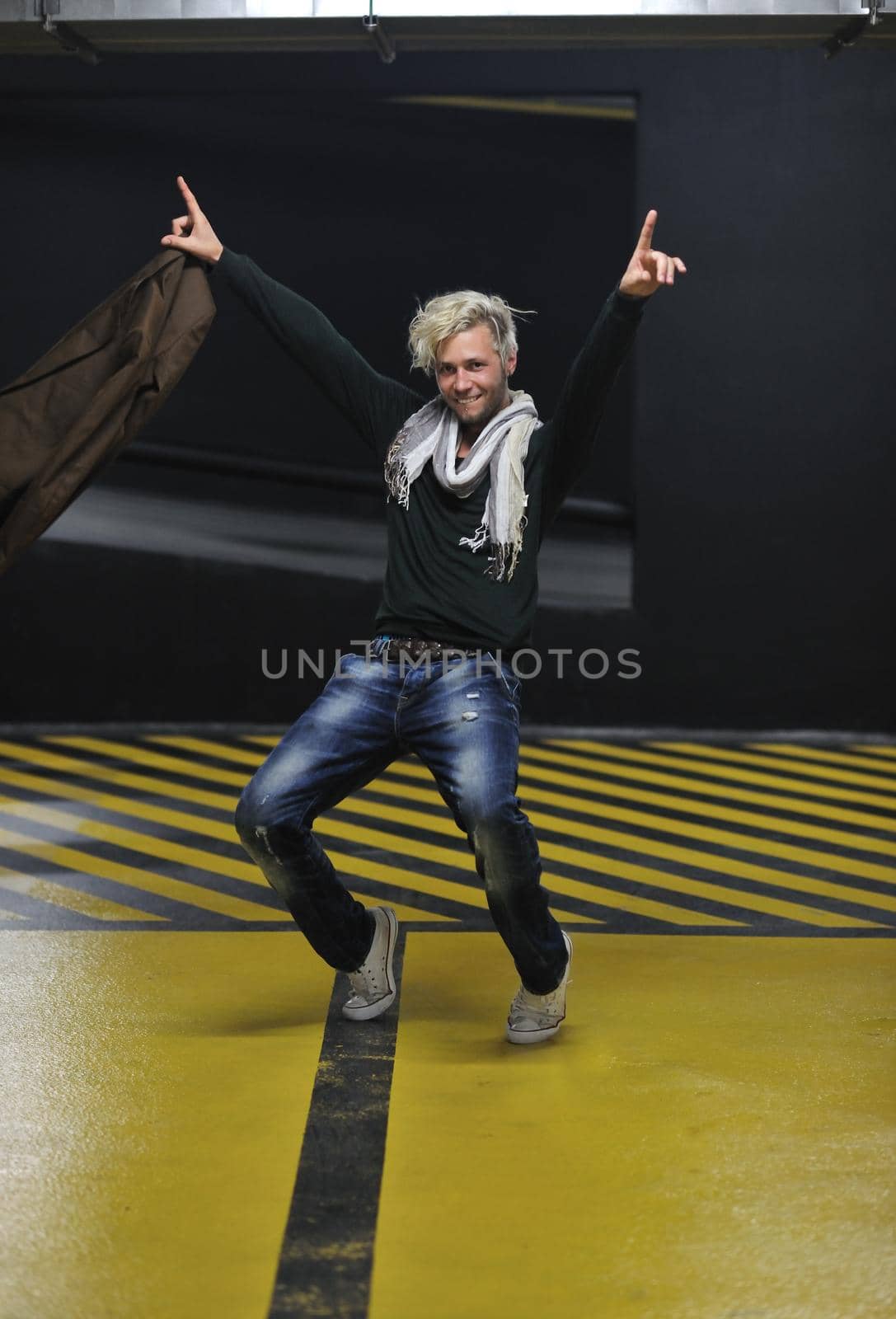 Portrait of an handsome young  man  with urban background and fashion clothes style