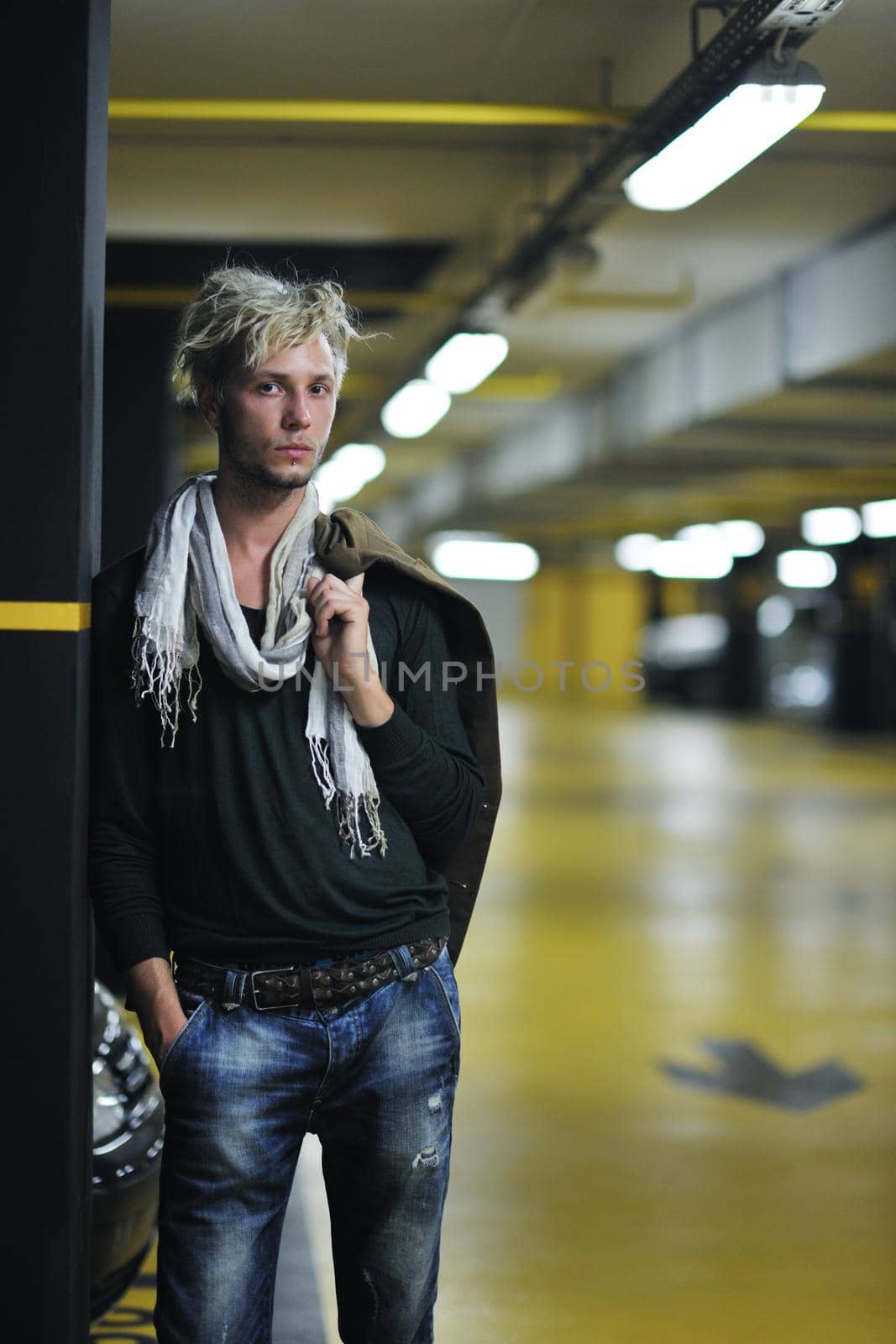 Portrait of an handsome young  man  with urban background and fashion clothes style