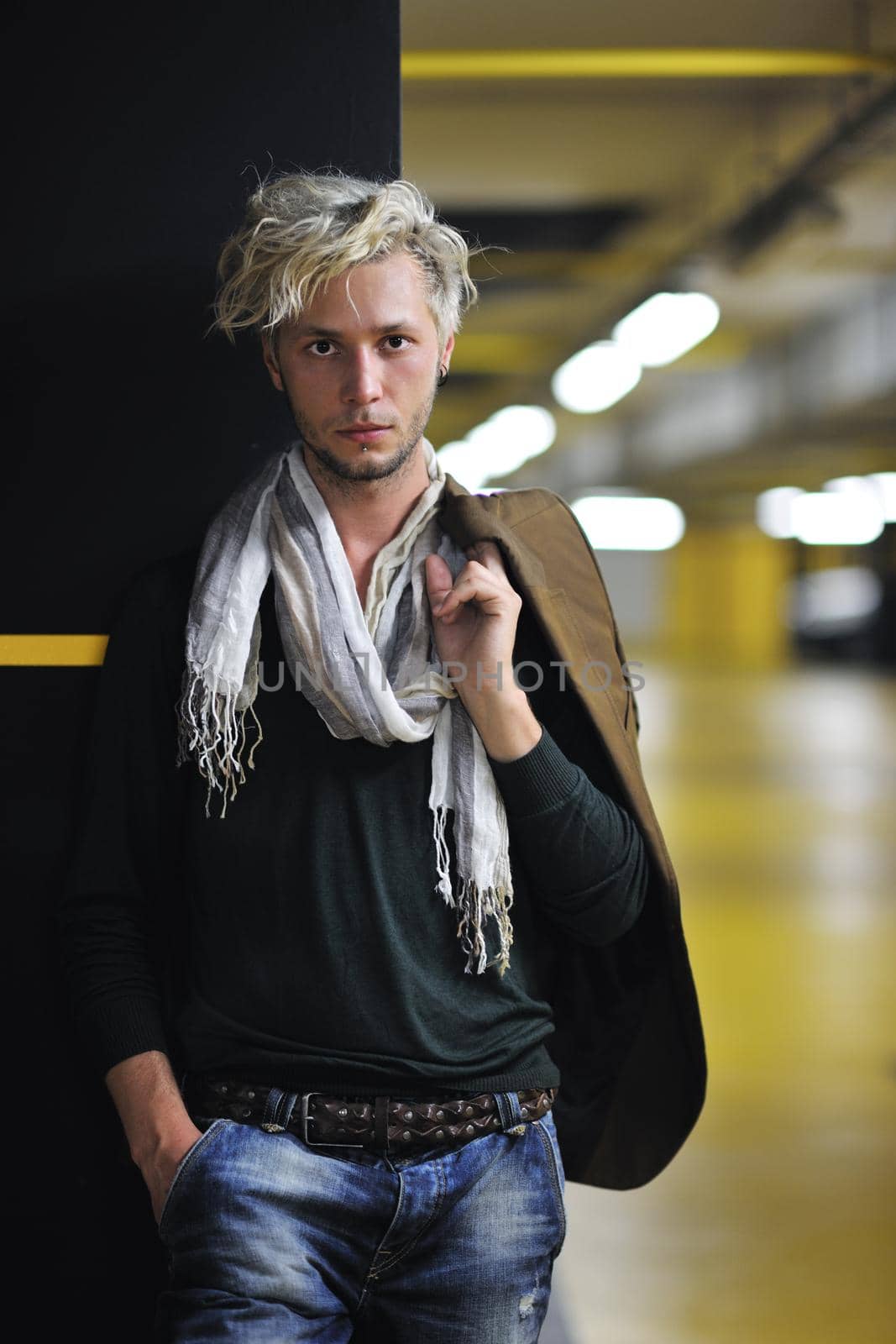 Portrait of an handsome young  man  with urban background and fashion clothes style