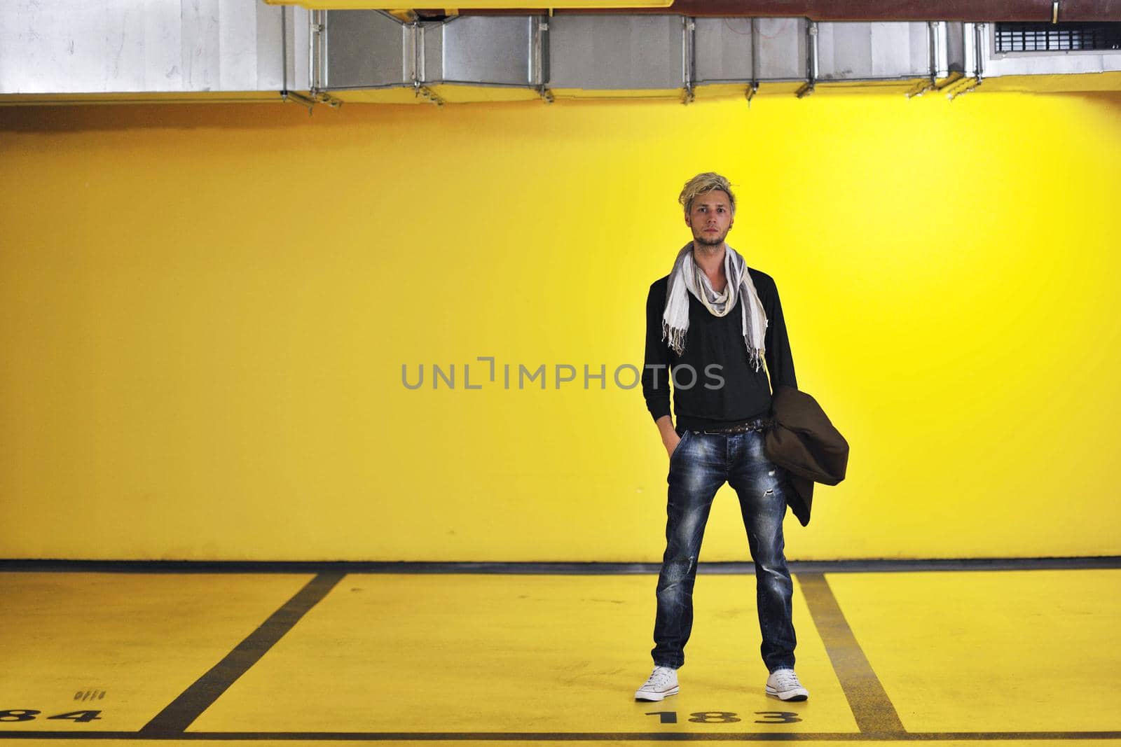 Portrait of an handsome young  man  with urban background and fashion clothes style