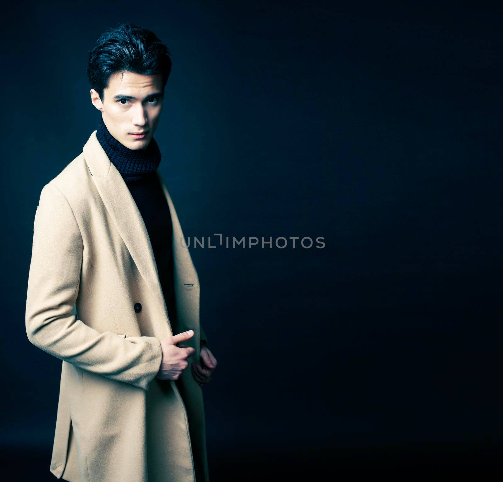 handsome asian fashion looking man posing in studio on black background, lifestyle modern people concept close up