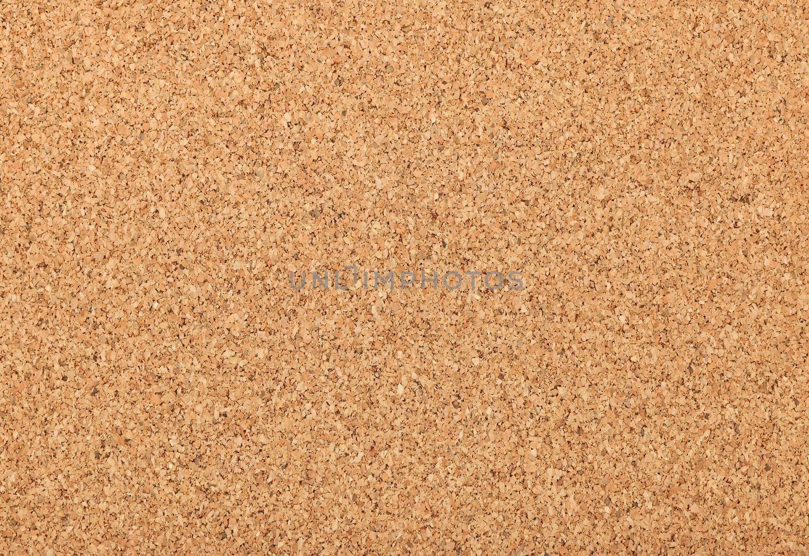 Close up background texture of unpainted natural brown cork board or plate, thermal insulating or interior sheet material also used for pin board