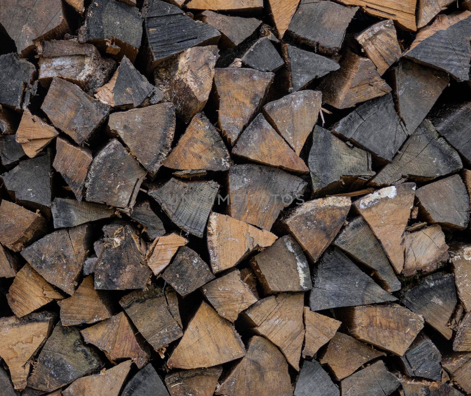 Stack pile of firewood oak wooden logs by BreakingTheWalls