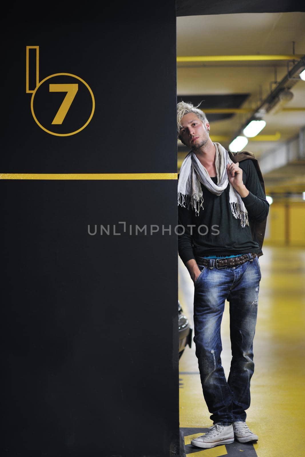 Portrait of an handsome young  man  with urban background and fashion clothes style