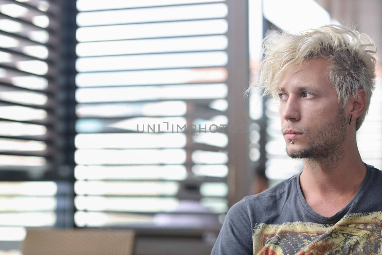 Portrait of an handsome young  man  with urban background and fashion clothes style