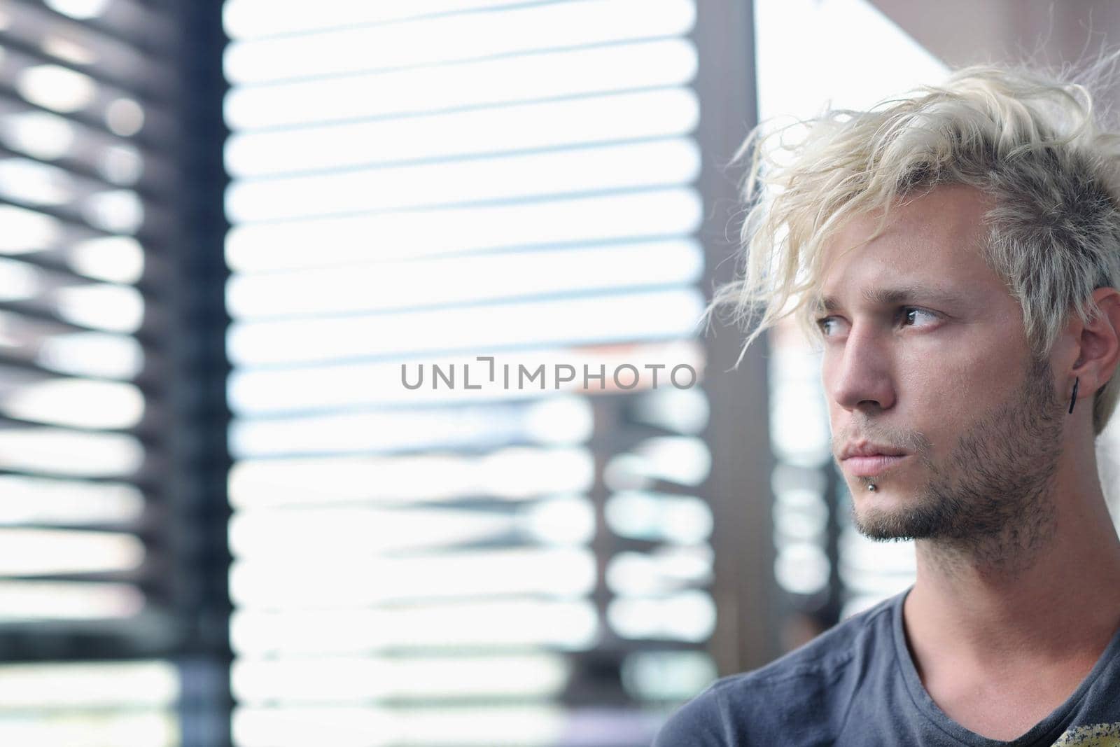 Portrait of an handsome young  man  with urban background and fashion clothes style