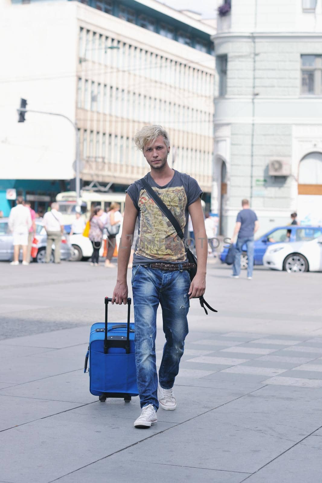 Portrait of an handsome young  man  with urban background and fashion clothes style