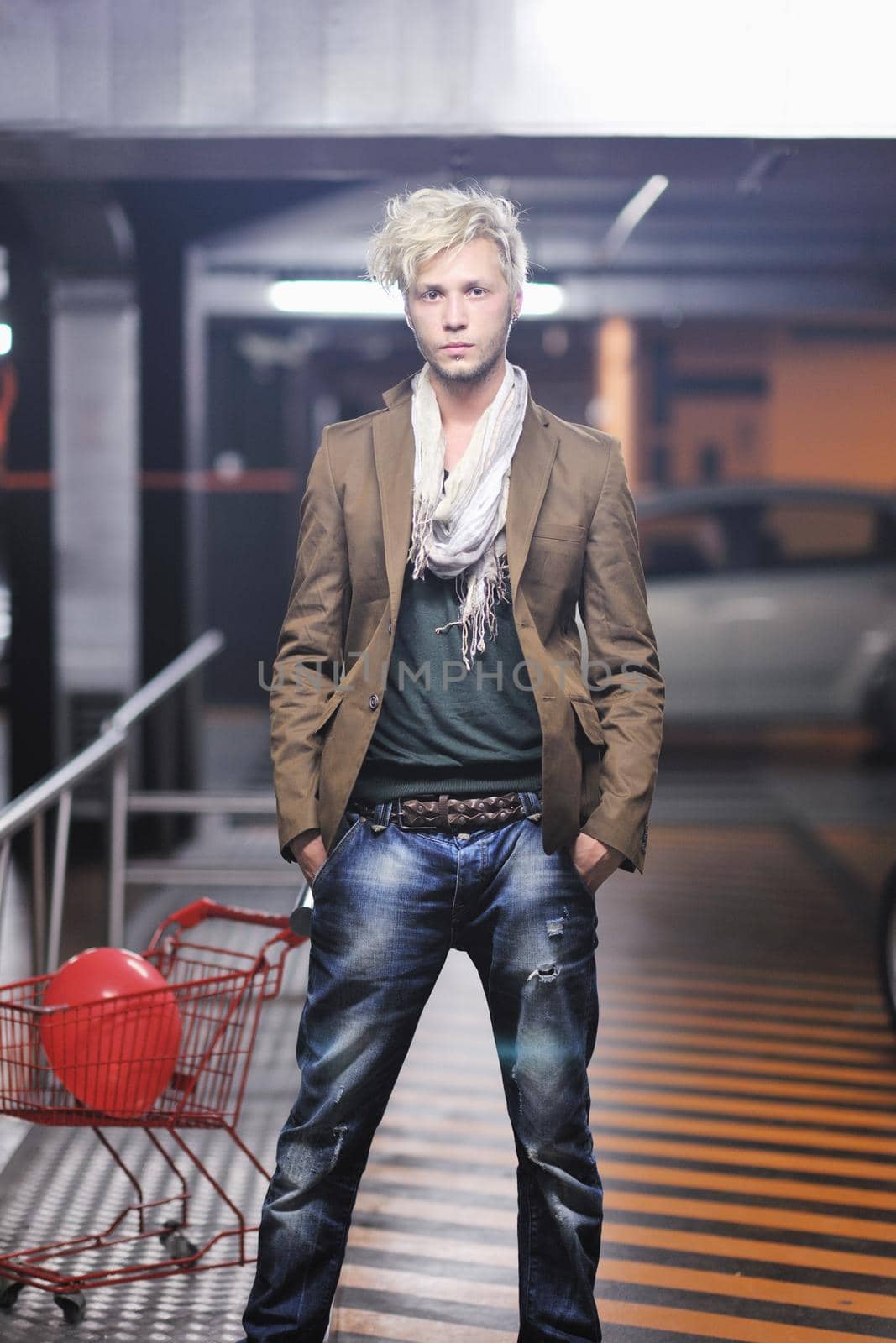 Portrait of an handsome young  man  with urban background and fashion clothes style