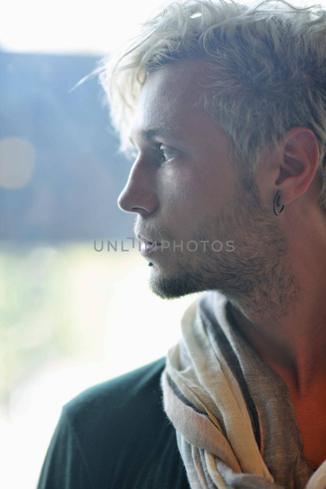 Portrait of an handsome young  man  with urban background and fashion clothes style