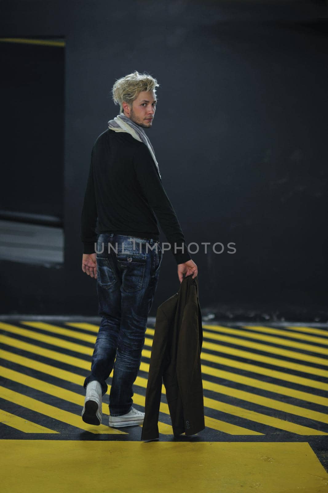 Portrait of an handsome young  man  with urban background and fashion clothes style