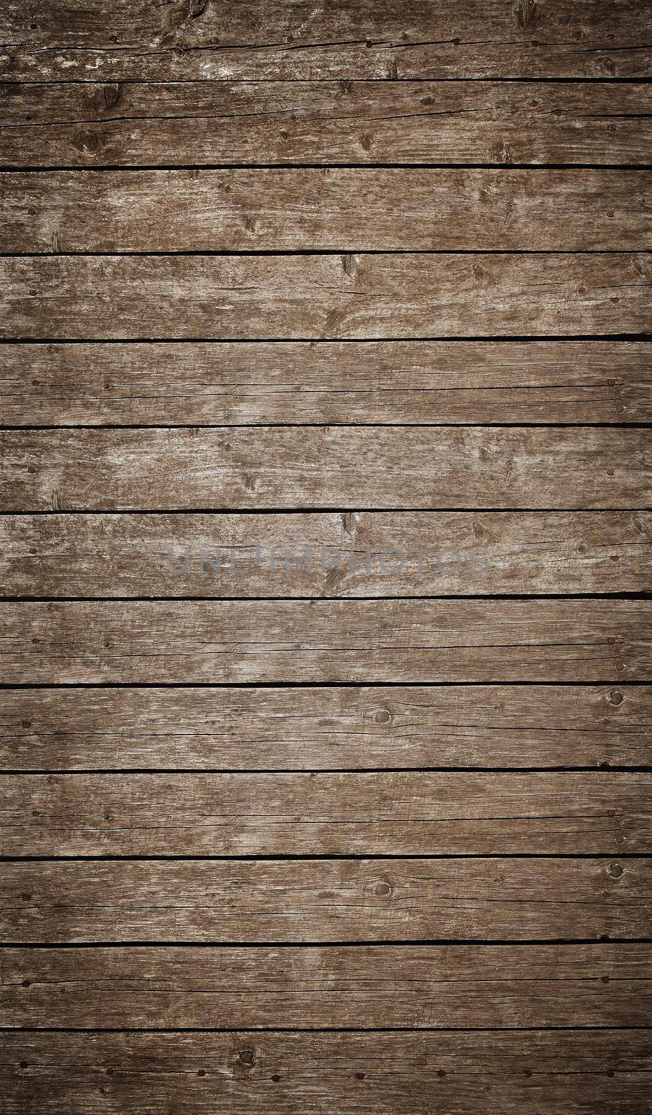Old brown vintage rustic weathered wooden fence planks background