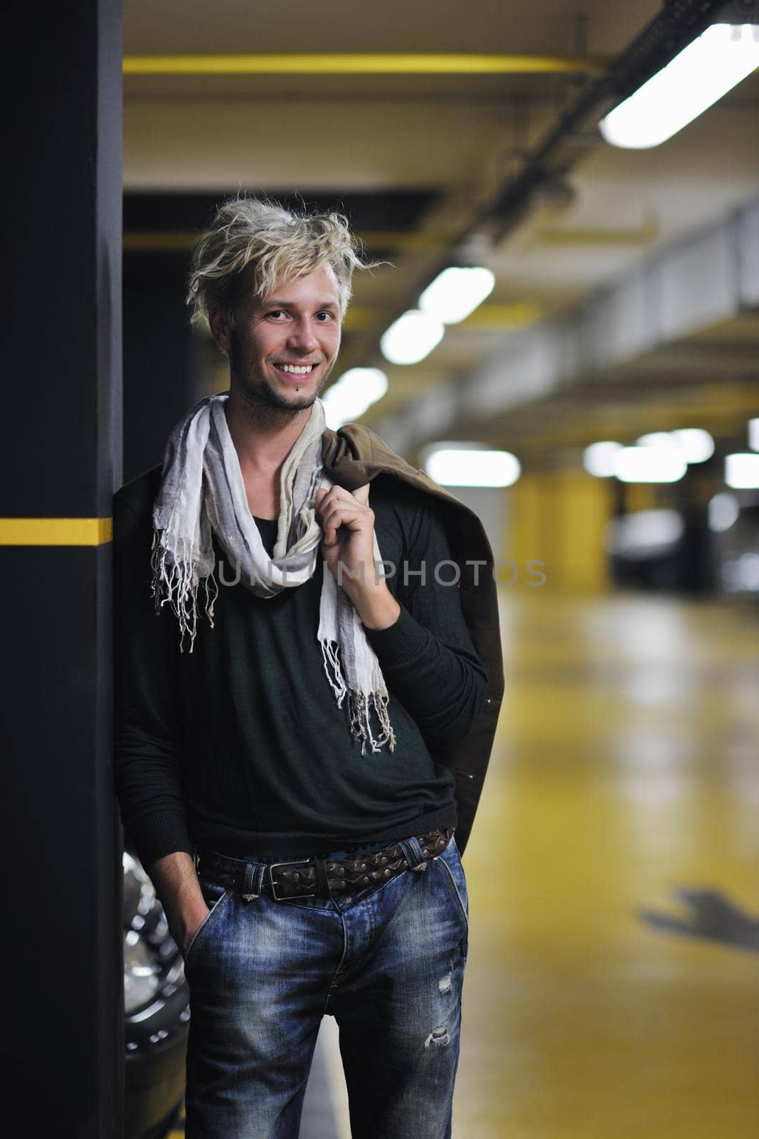 Portrait of an handsome young  man  with urban background and fashion clothes style