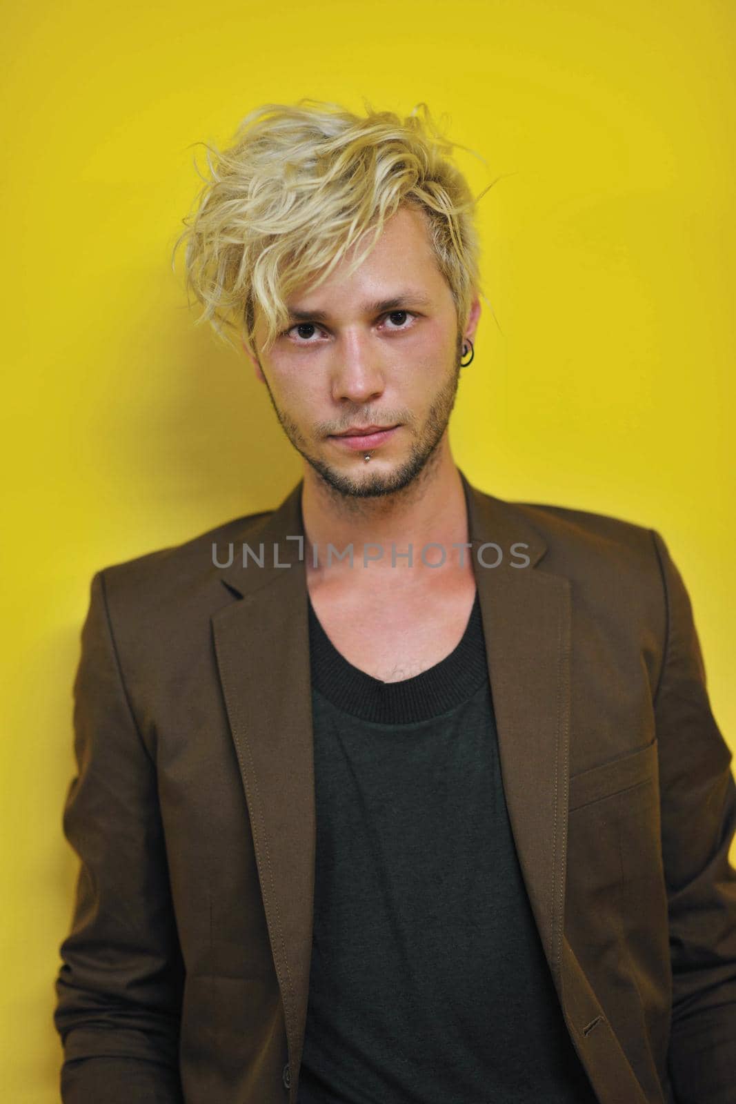 Portrait of an handsome young  man  with urban background and fashion clothes style