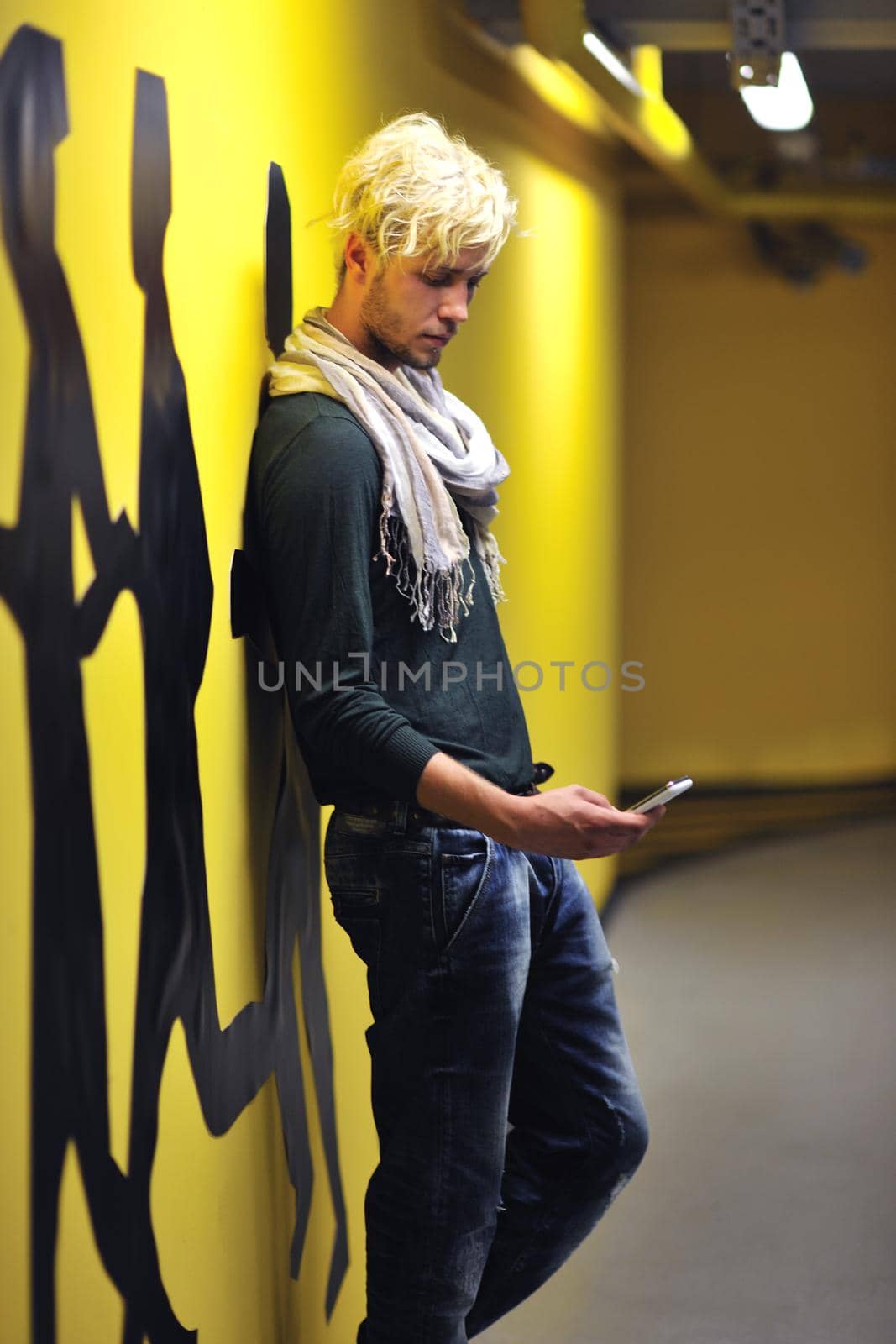 Portrait of an handsome young  man  with urban background and fashion clothes style