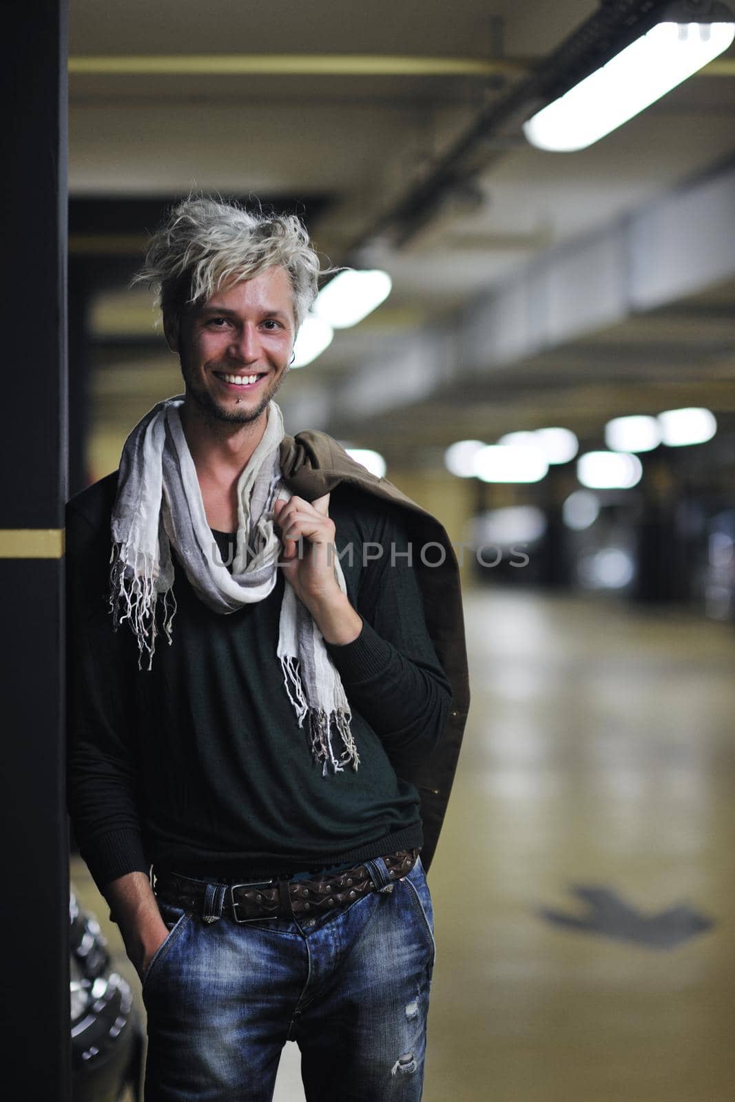 Portrait of an handsome young  man  with urban background and fashion clothes style