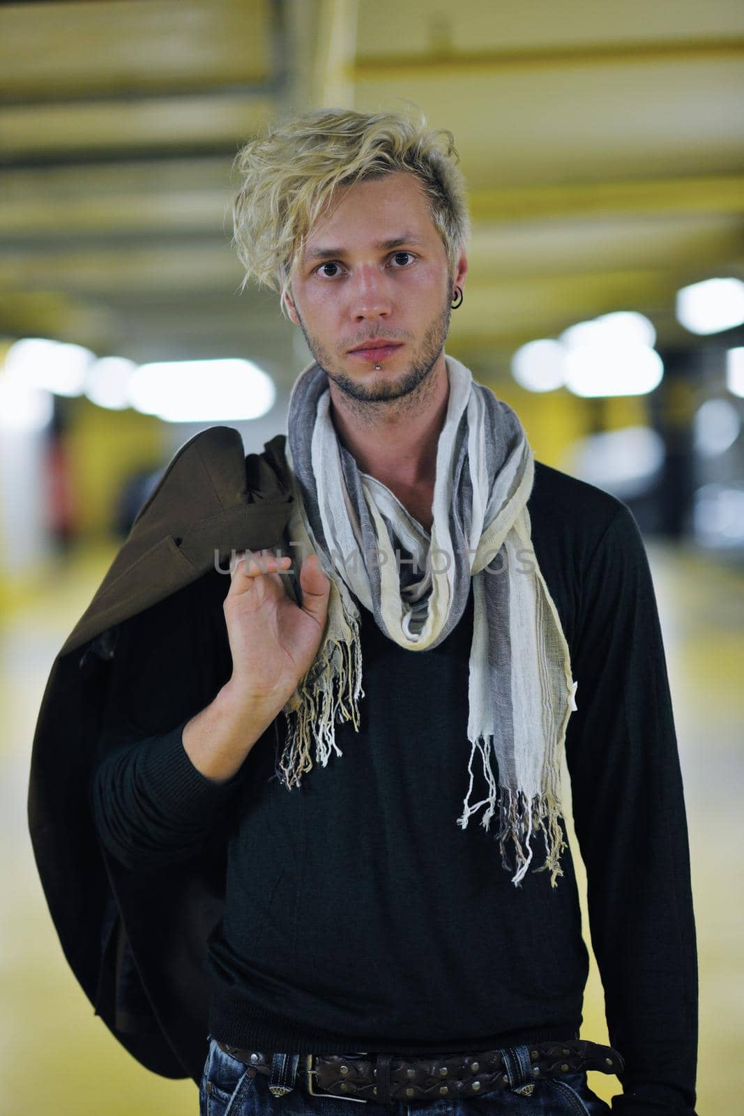 Portrait of an handsome young  man  with urban background and fashion clothes style