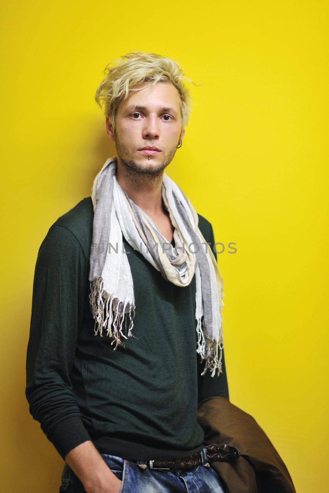 Portrait of an handsome young  man  with urban background and fashion clothes style