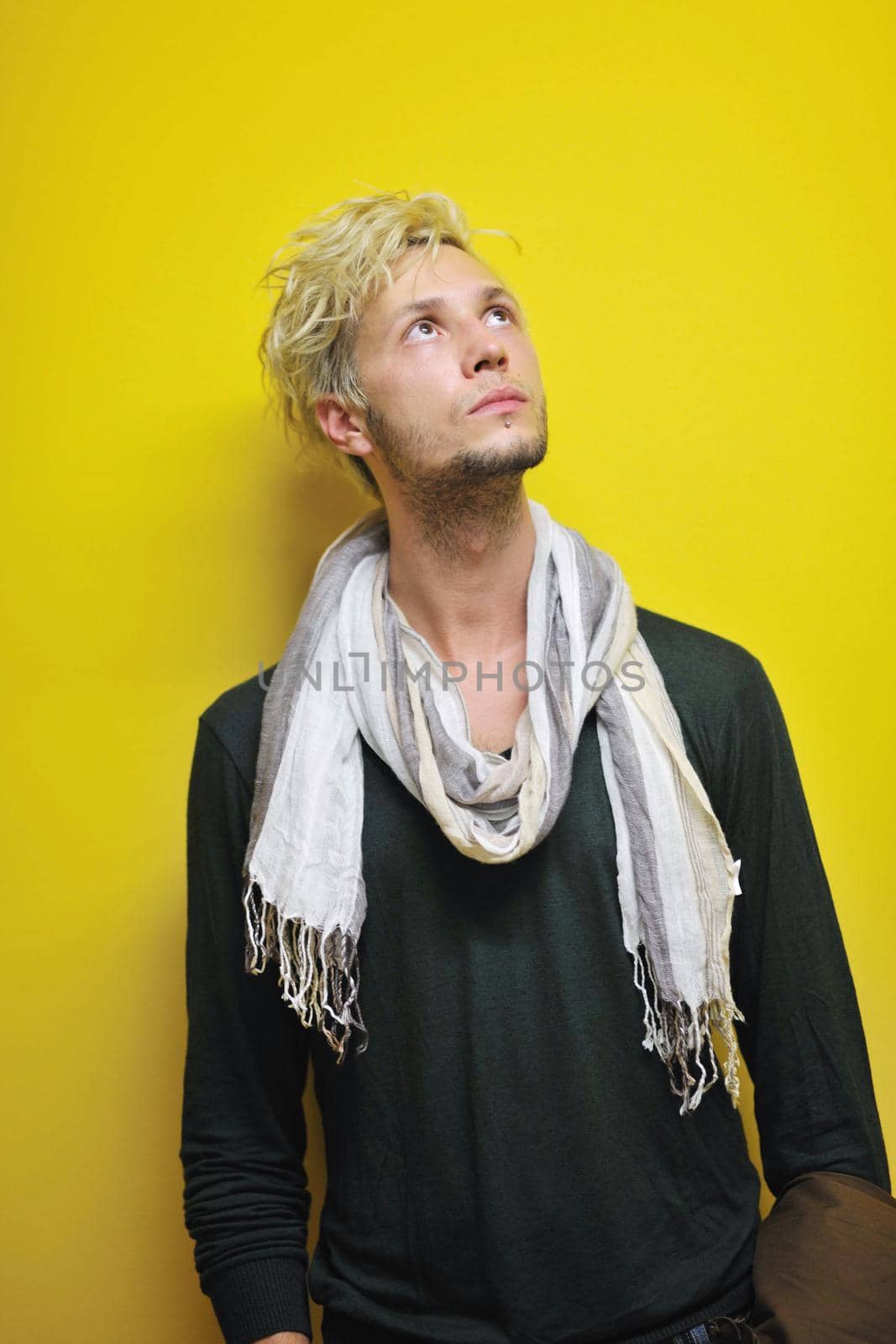 Portrait of an handsome young  man  with urban background and fashion clothes style