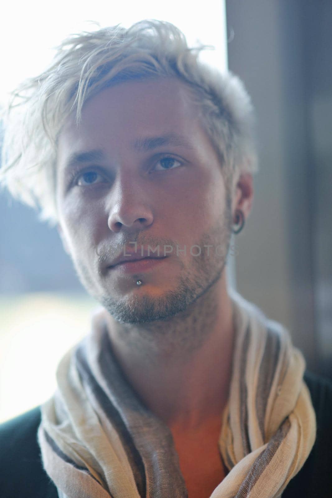 Portrait of an handsome young  man  with urban background and fashion clothes style