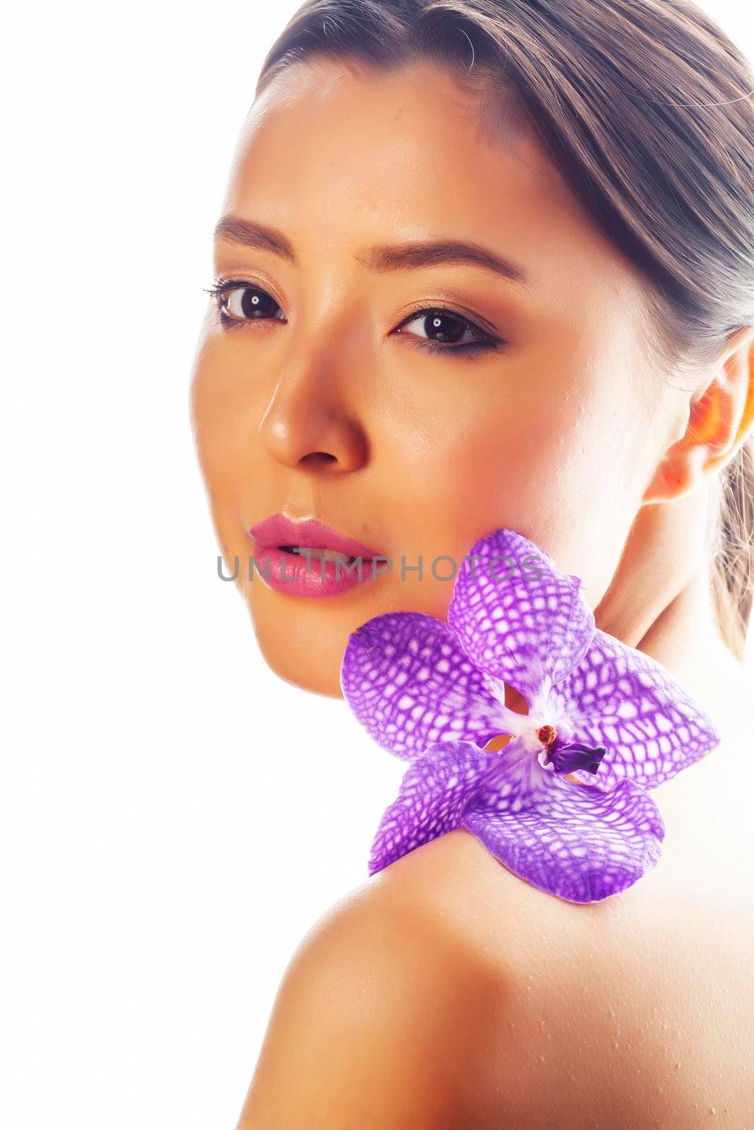 young pretty asian woman with flower purple orchid isolated on white background, spa people concept by JordanJ