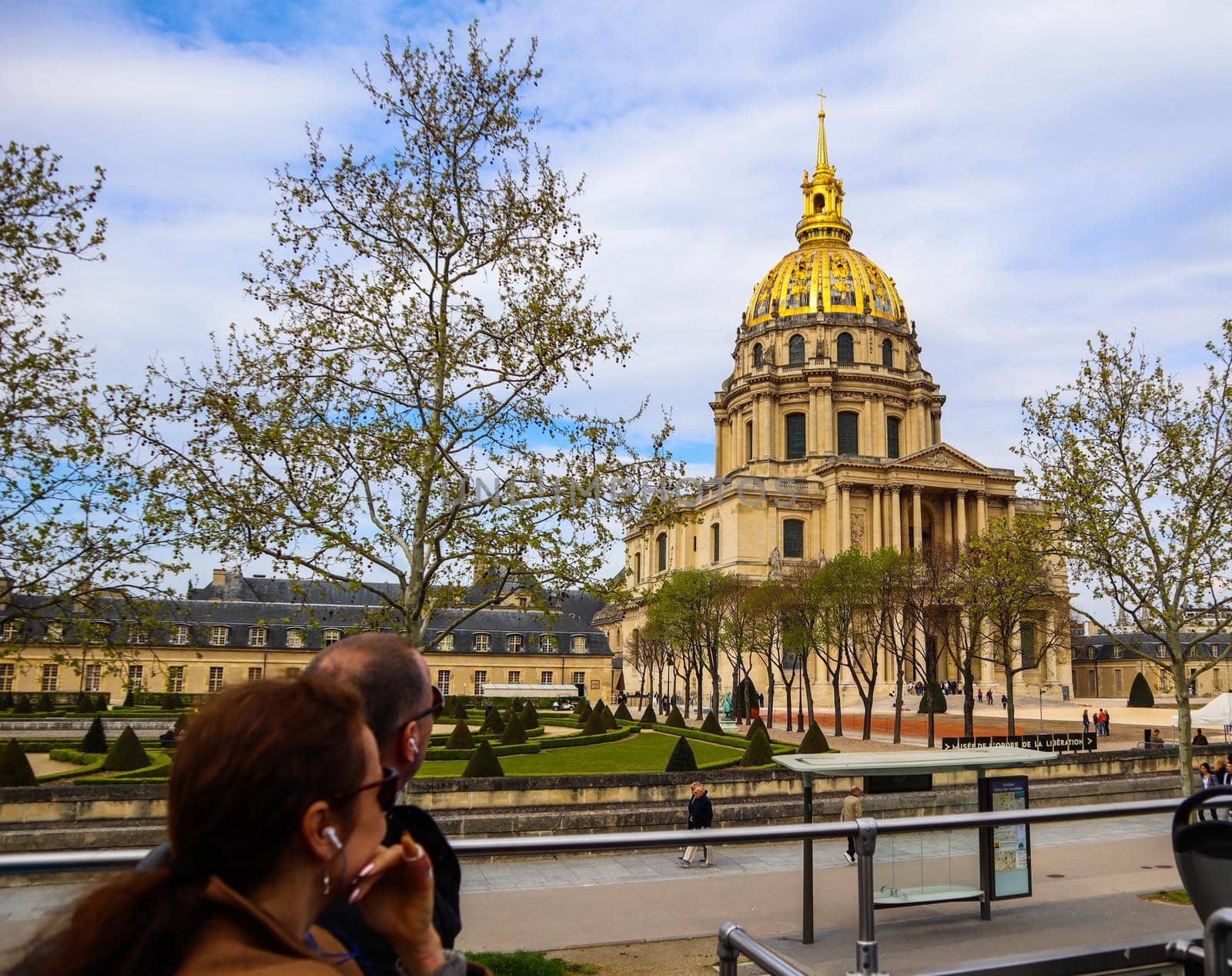 Domed Church of the Invalides and tourists on a tourist bus in Paris. France. April 2019