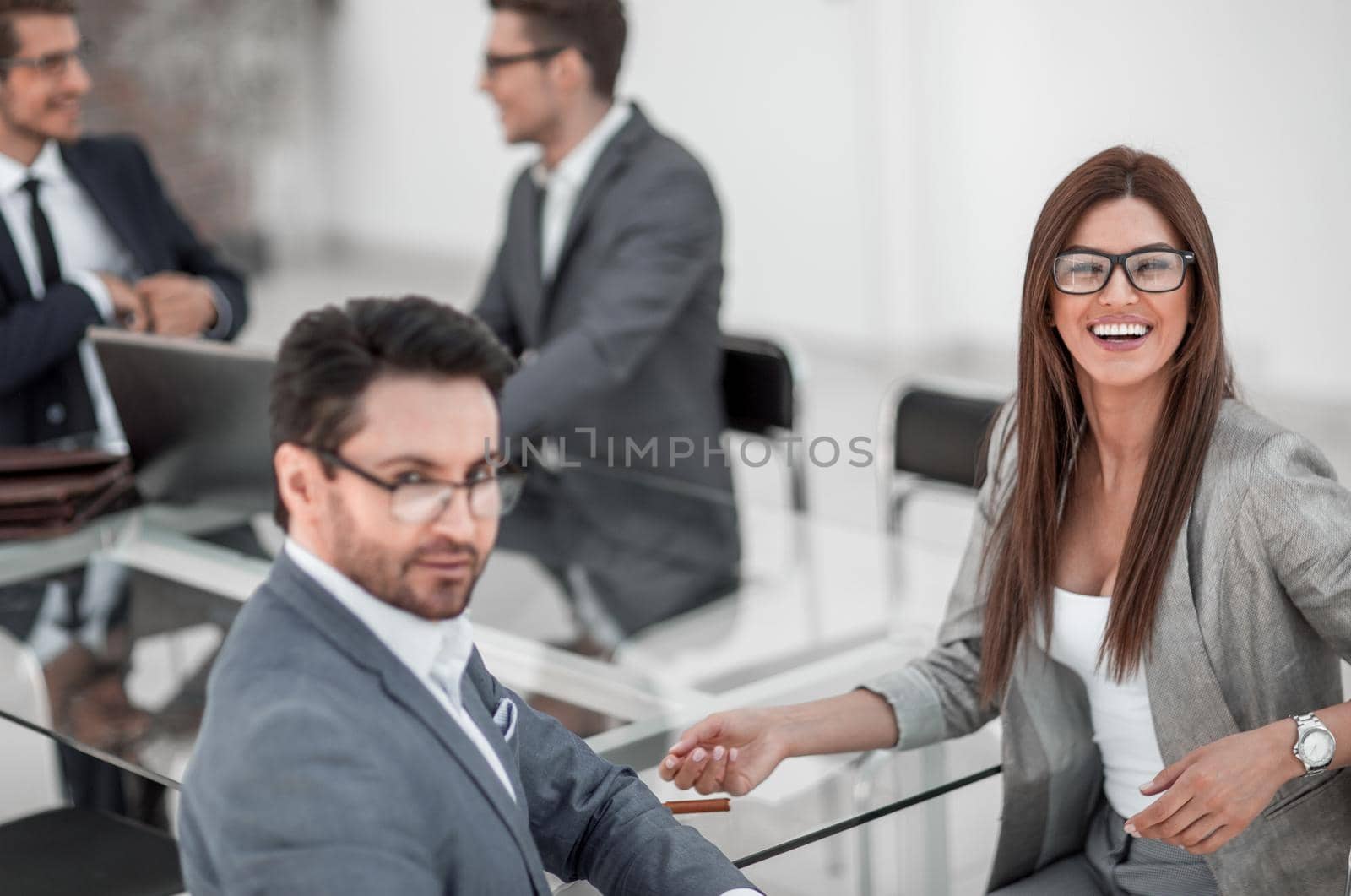 businessman and business woman sitting at office Desk.business concept