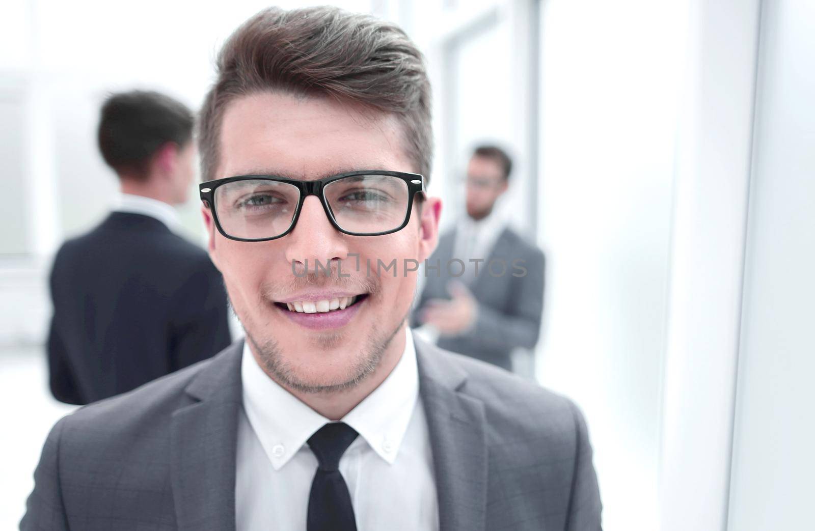 close up.successful young businessman on blurred office background.