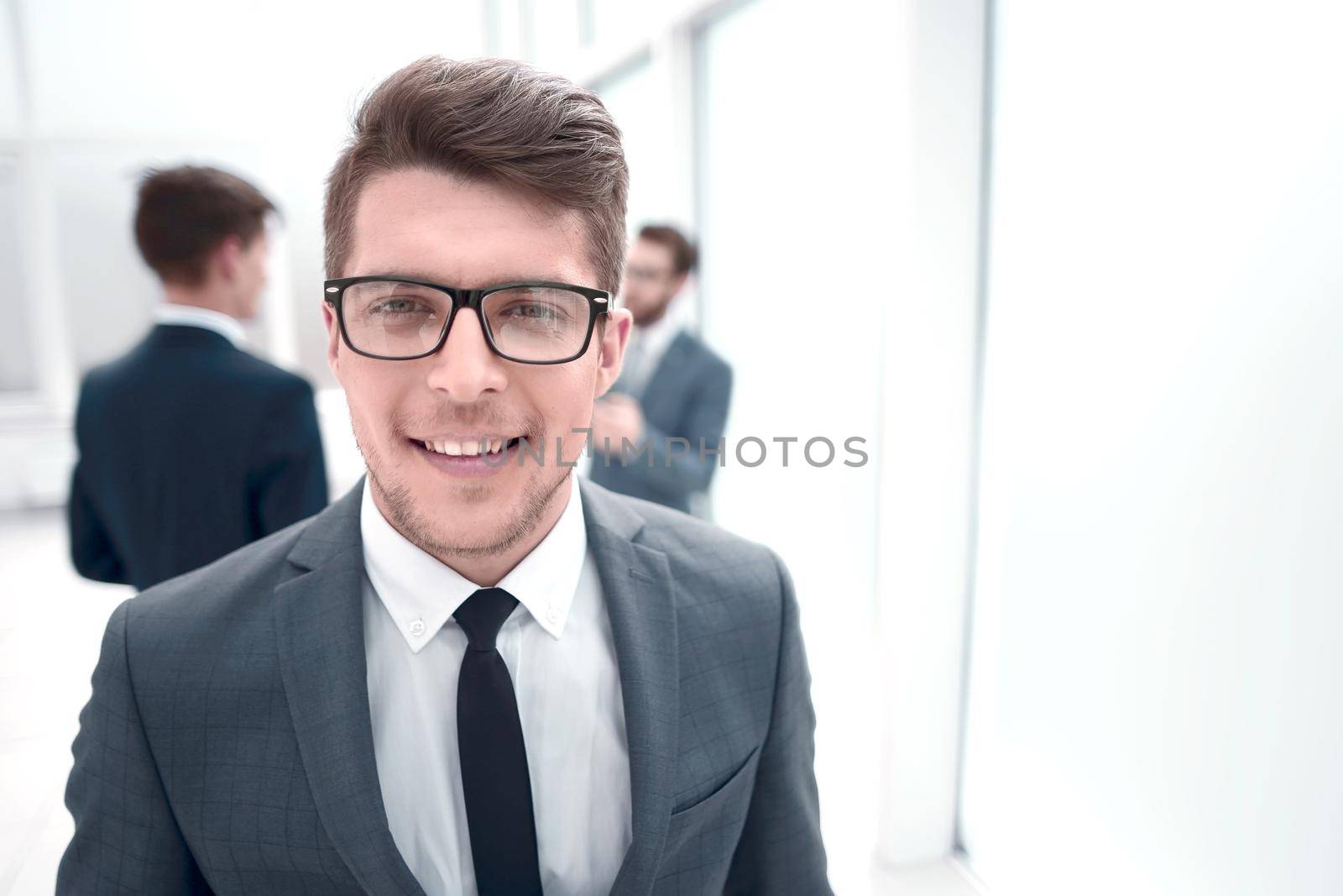 close up.successful young businessman on blurred office background.