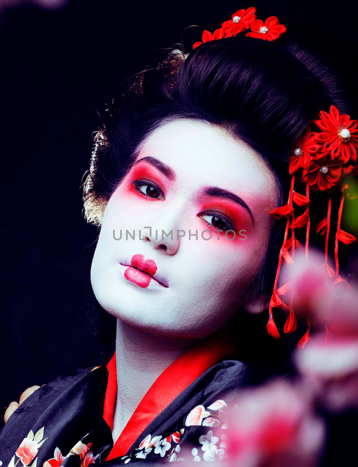 young pretty real geisha in kimono with sakura and decoration on black background by JordanJ