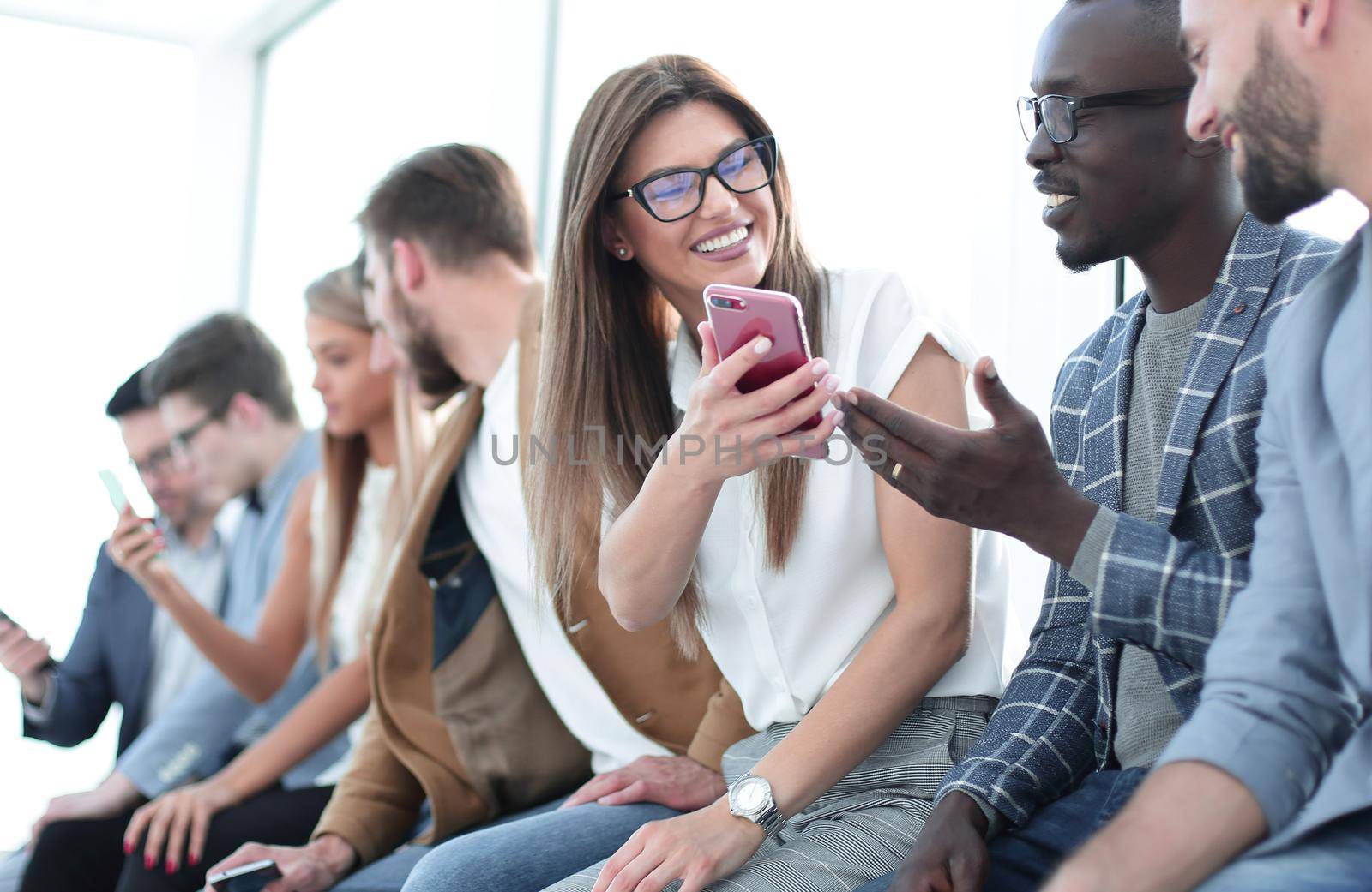 group of young people with smartphones by asdf