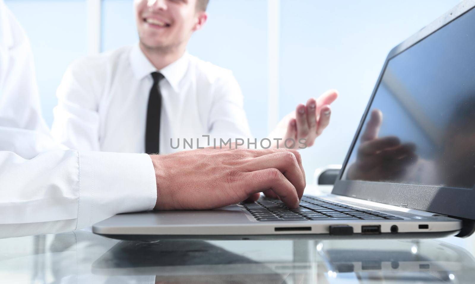 Close up of male hands typing on laptop keyboard. Business working concept. Blogger, journalist writing new article
