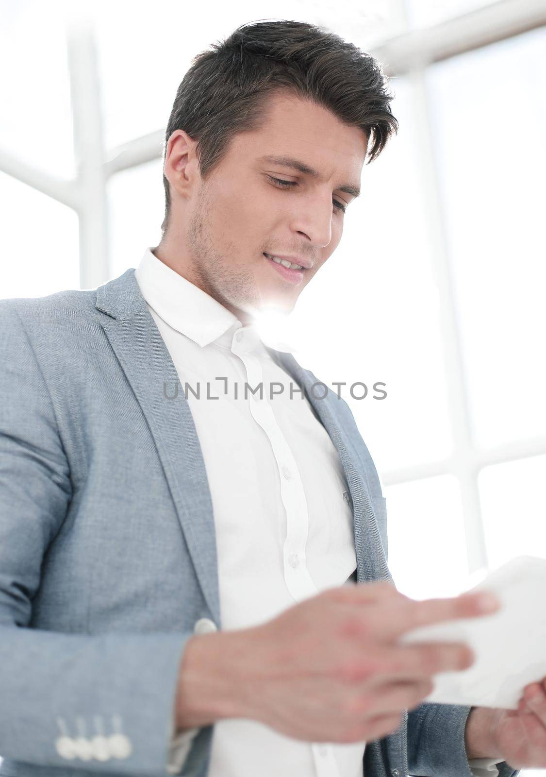 close up.businessman with digital tablet by asdf