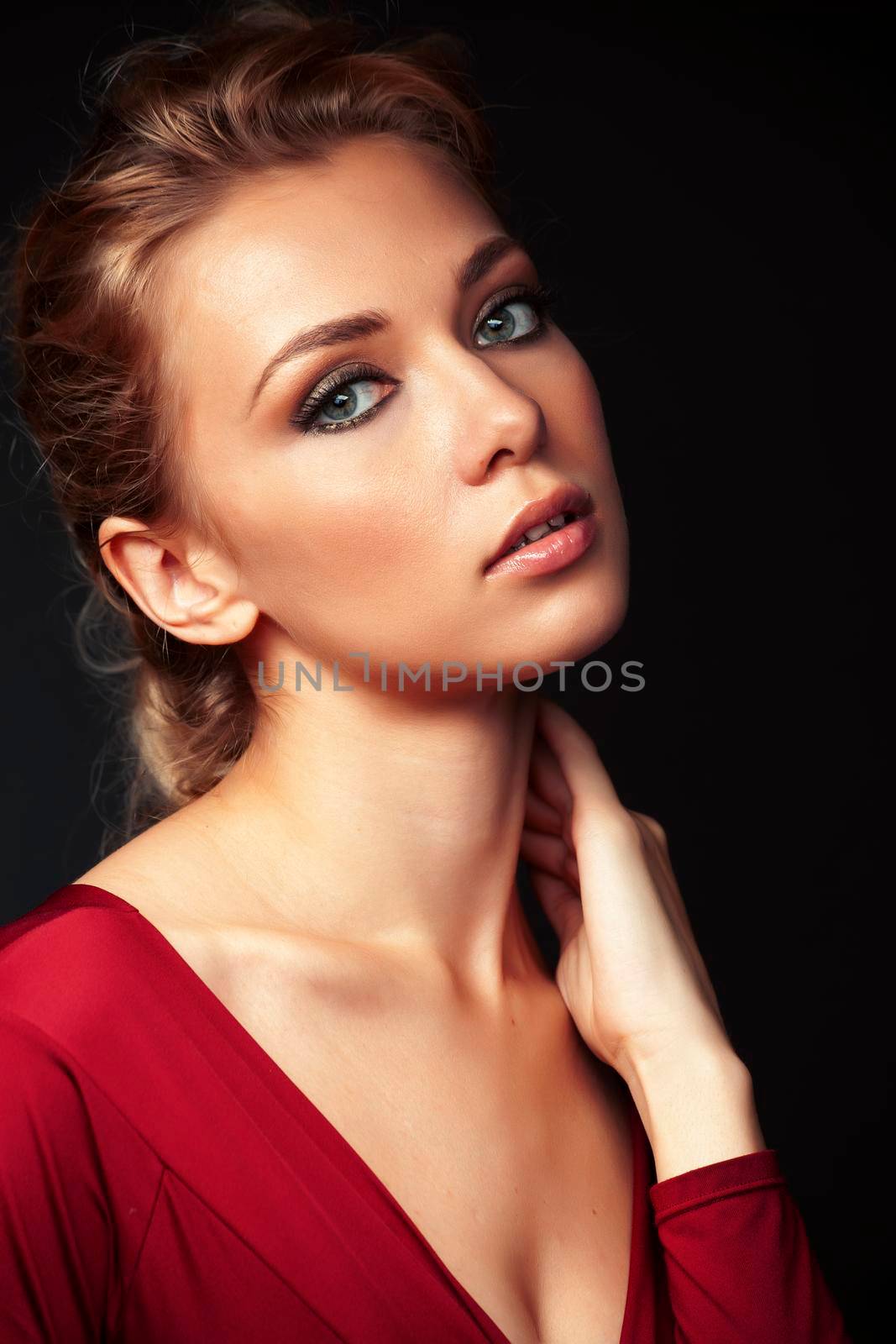 young sensual blond woman posing on black background, lifestyle people concept close up