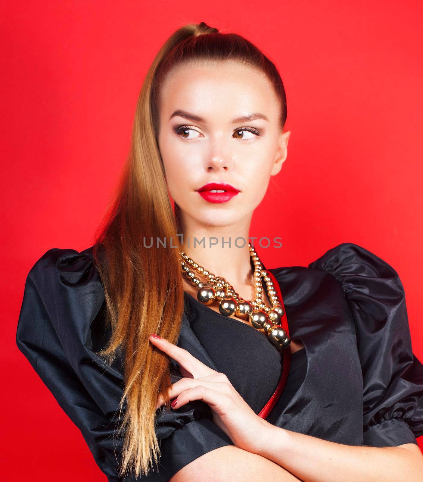young pretty woman young lady posing on red background, lifestyle people concept by JordanJ