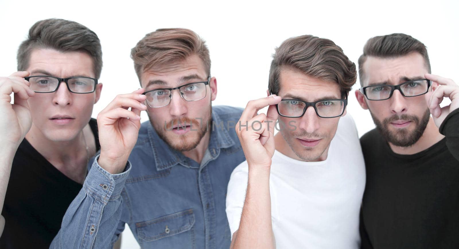 team of businessmen adjusts glasses standing on white background