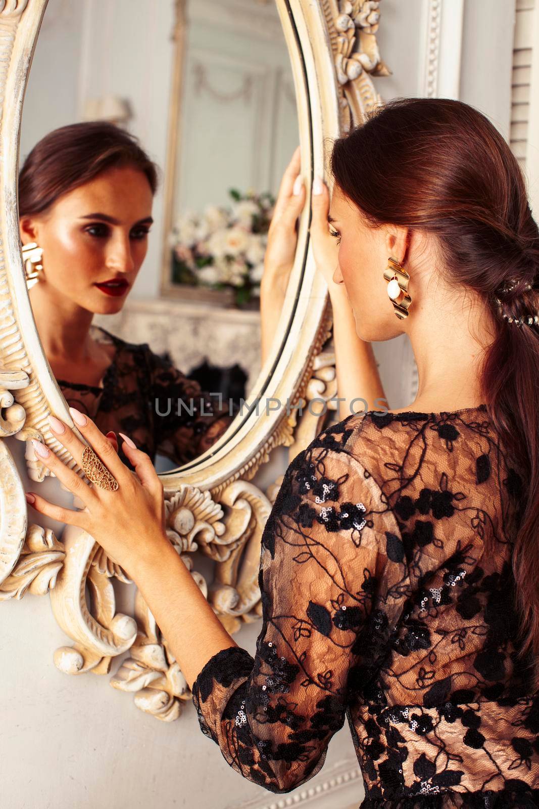young pretty lady in black lace fashion style dress posing in rich interior of royal hotel room, luxury lifestyle people concept close up