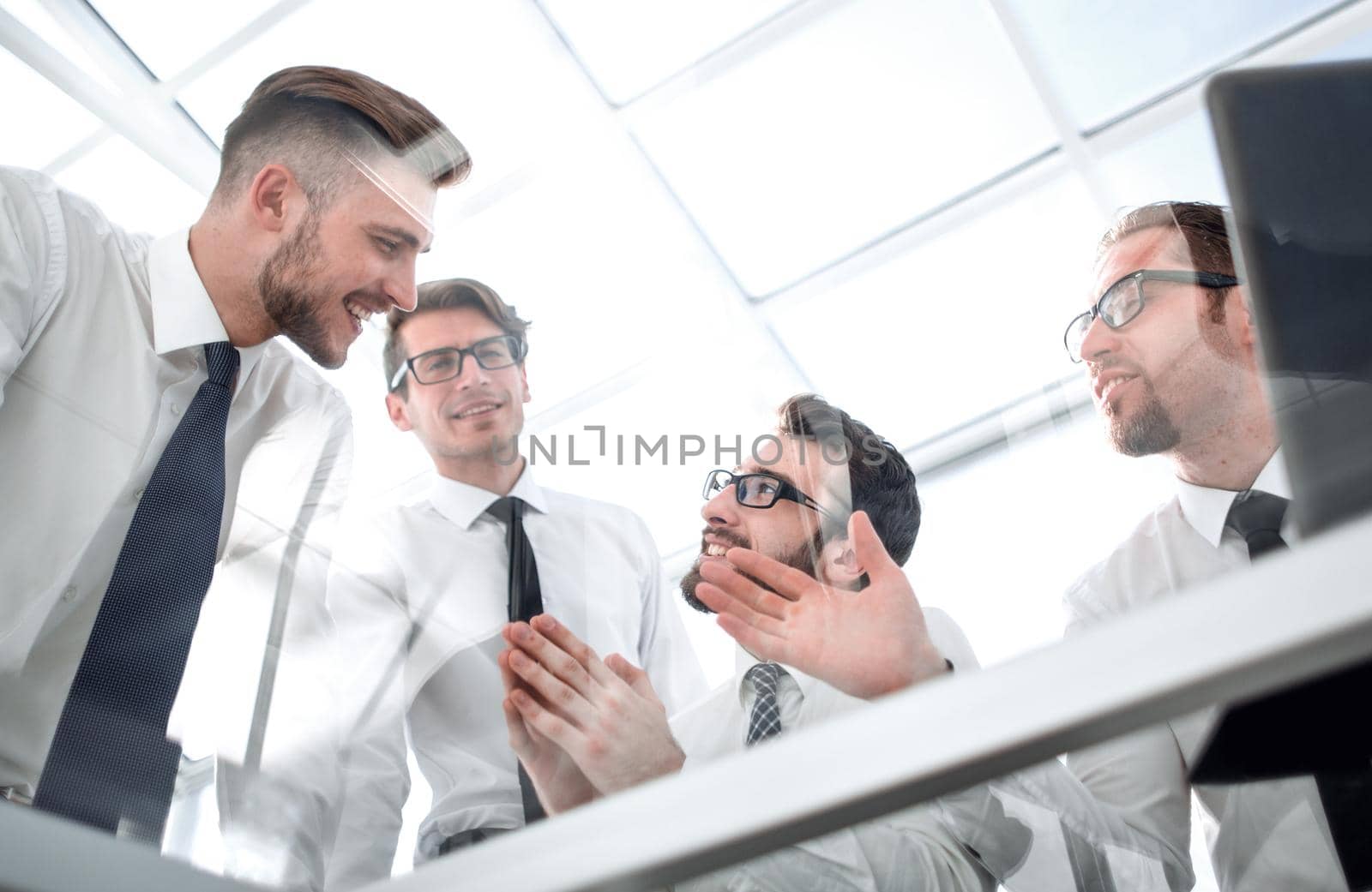 bottom view.business team discussing near the table by asdf