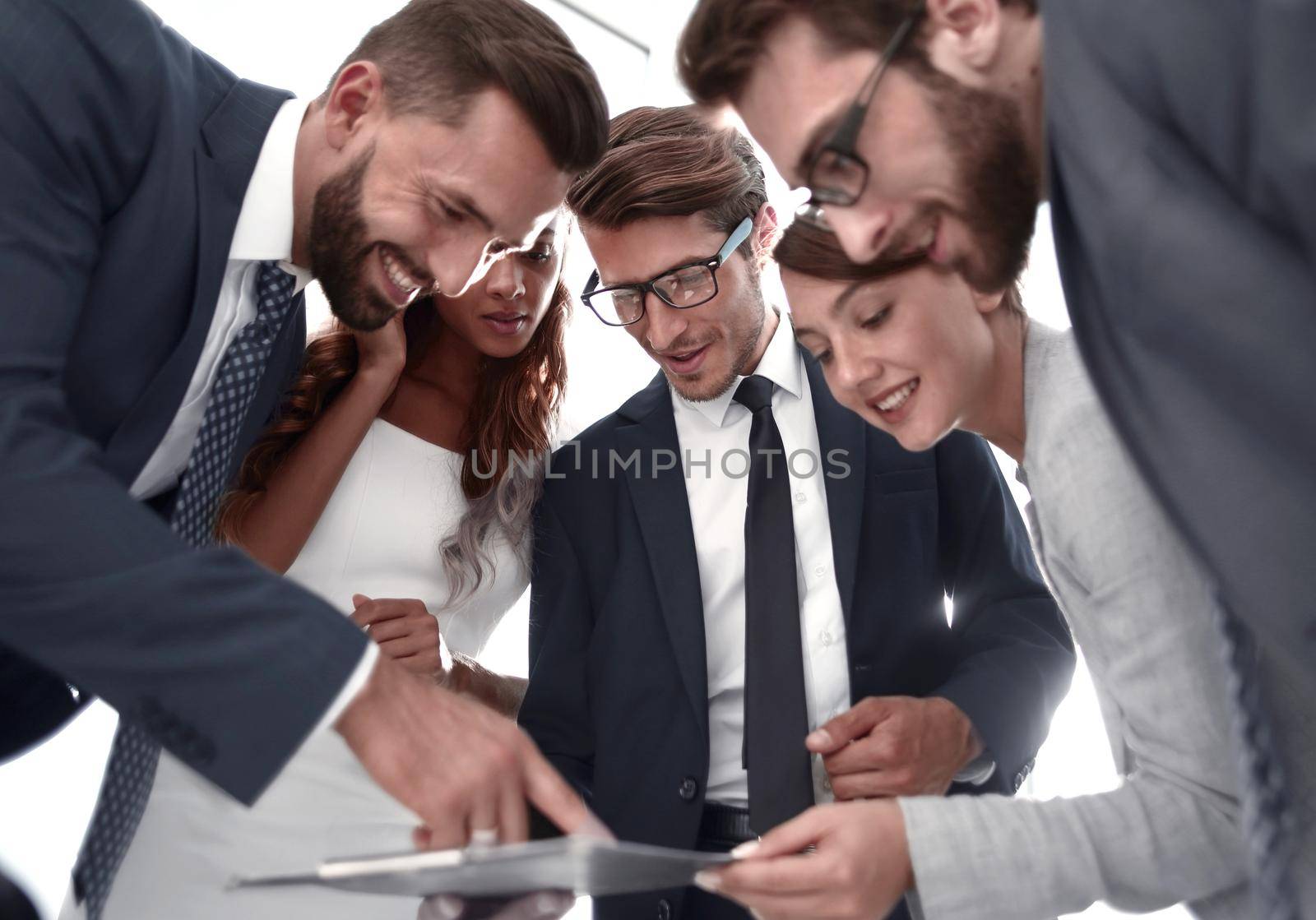 close up.business team discussing the terms of the contract, standing near the office Desk .business concept