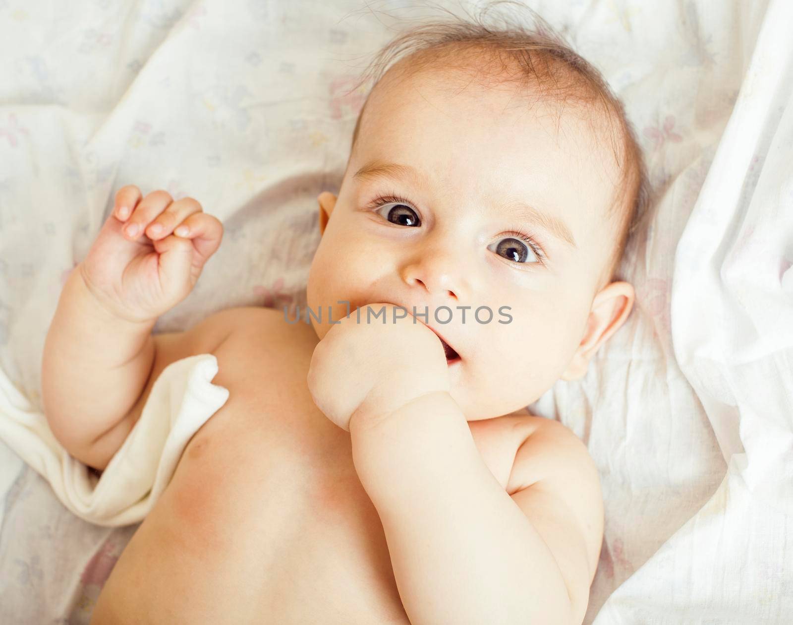 little cute baby toddler on carpet close up smiling, adorable kid by JordanJ