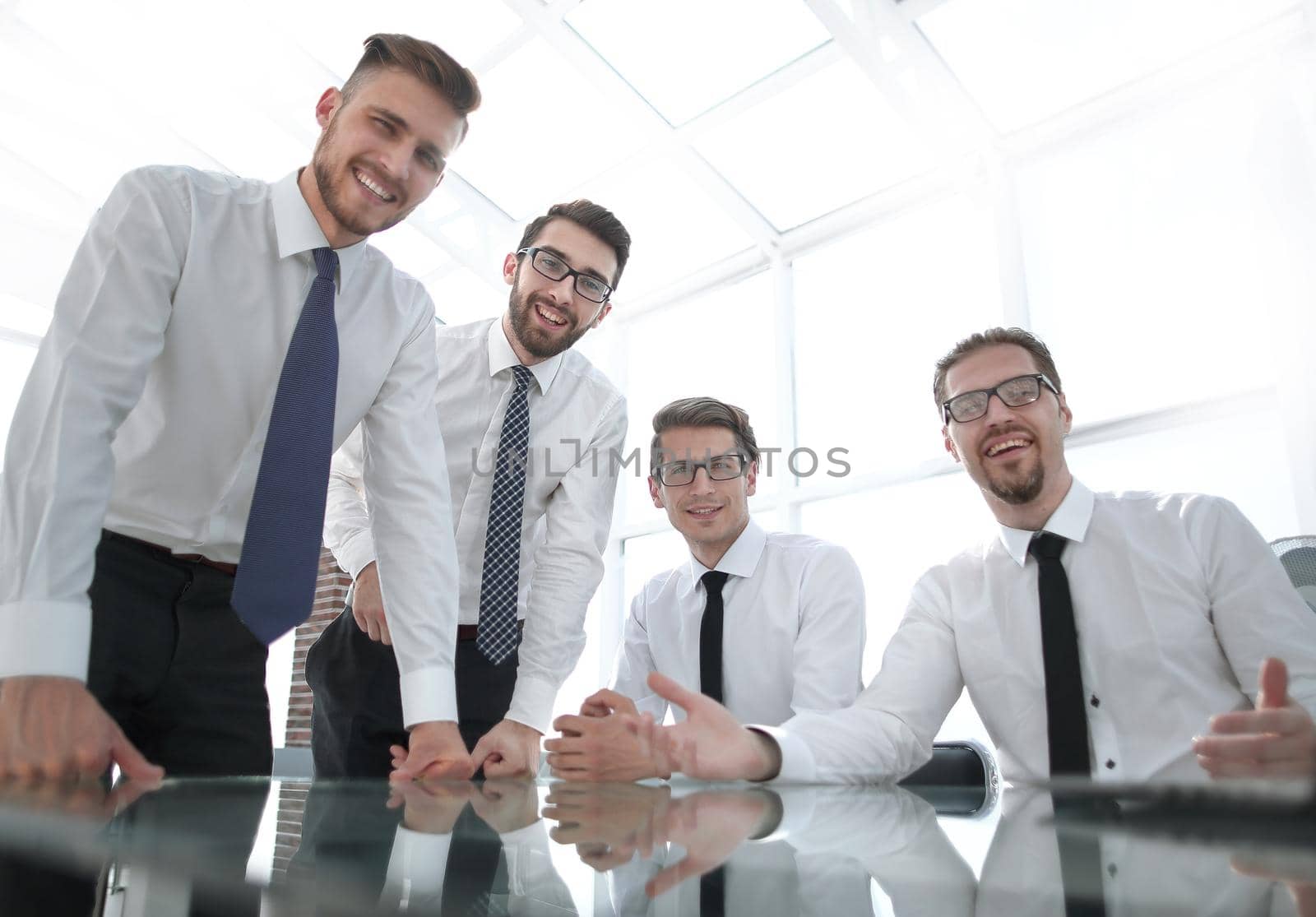 professional business team standing near the desktop by asdf