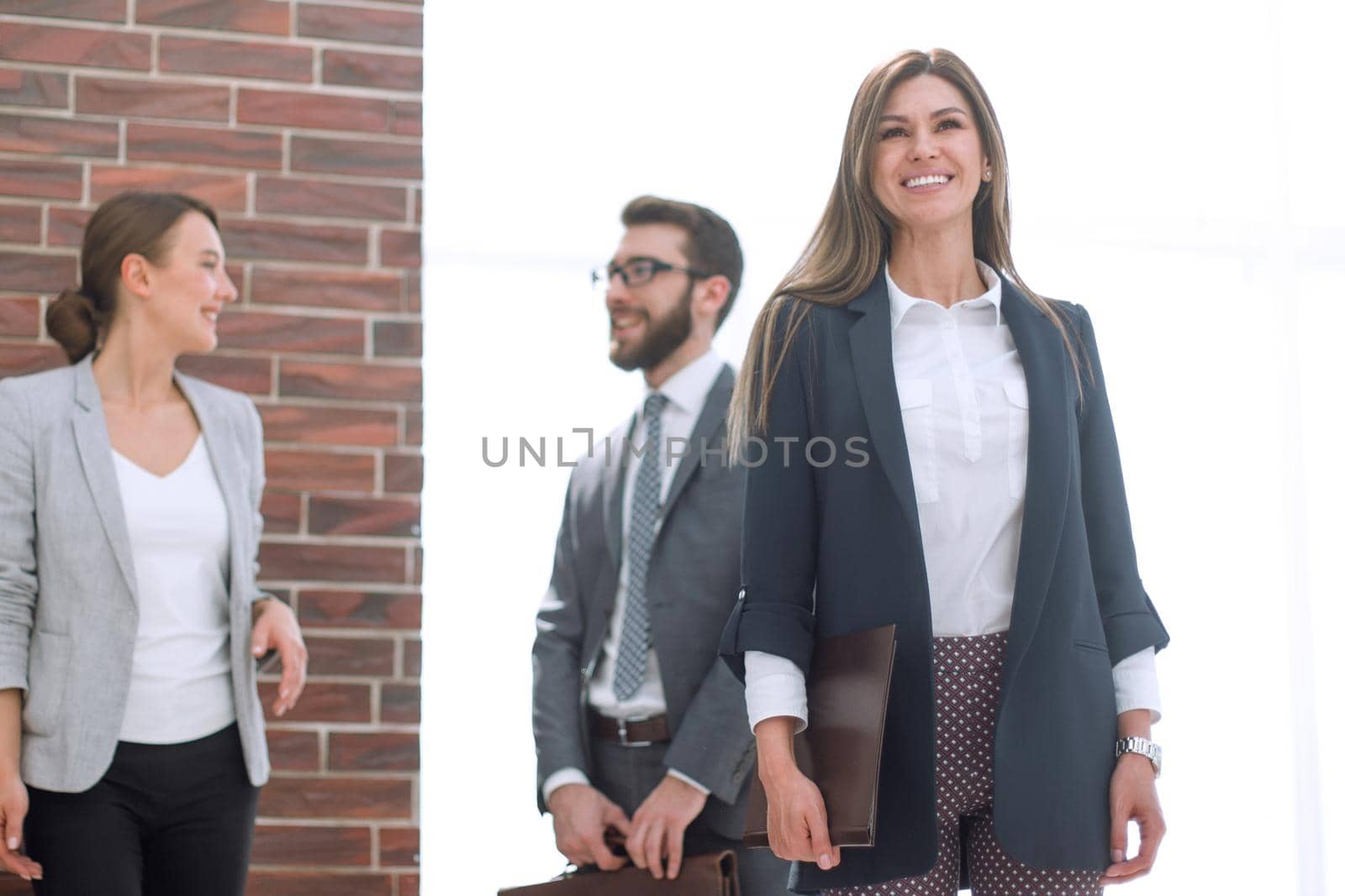 modern business woman standing in a spacious office by asdf