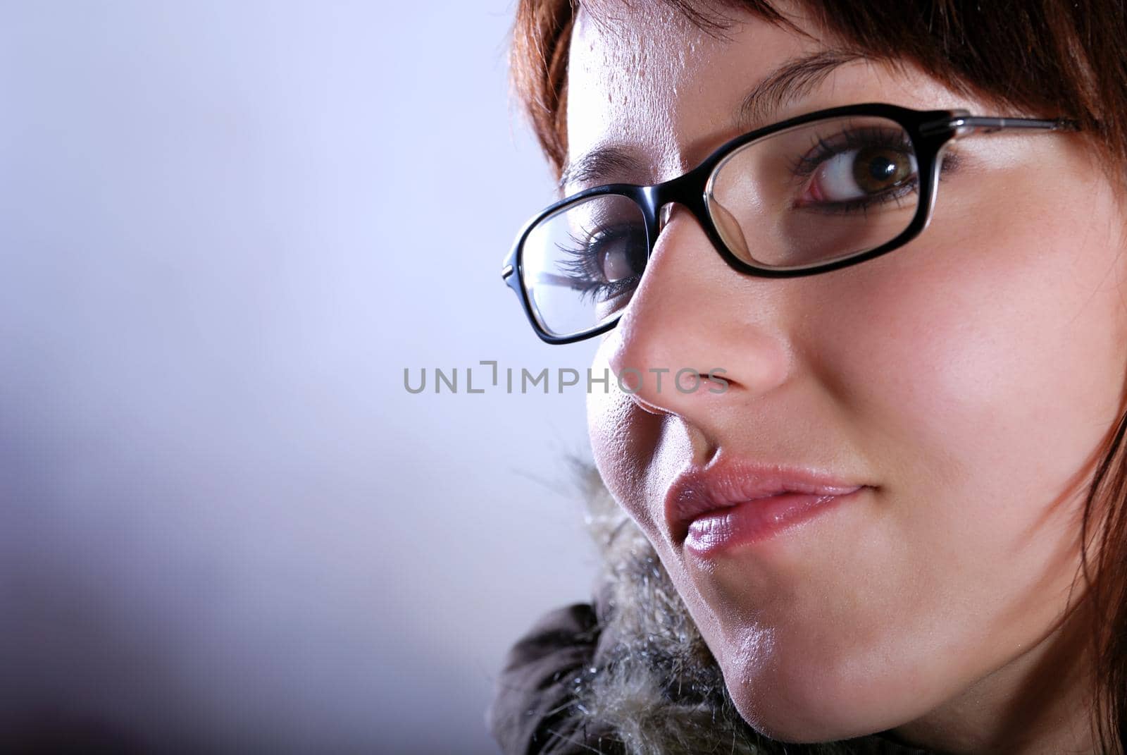 Portrai of a young woman wearing glasses