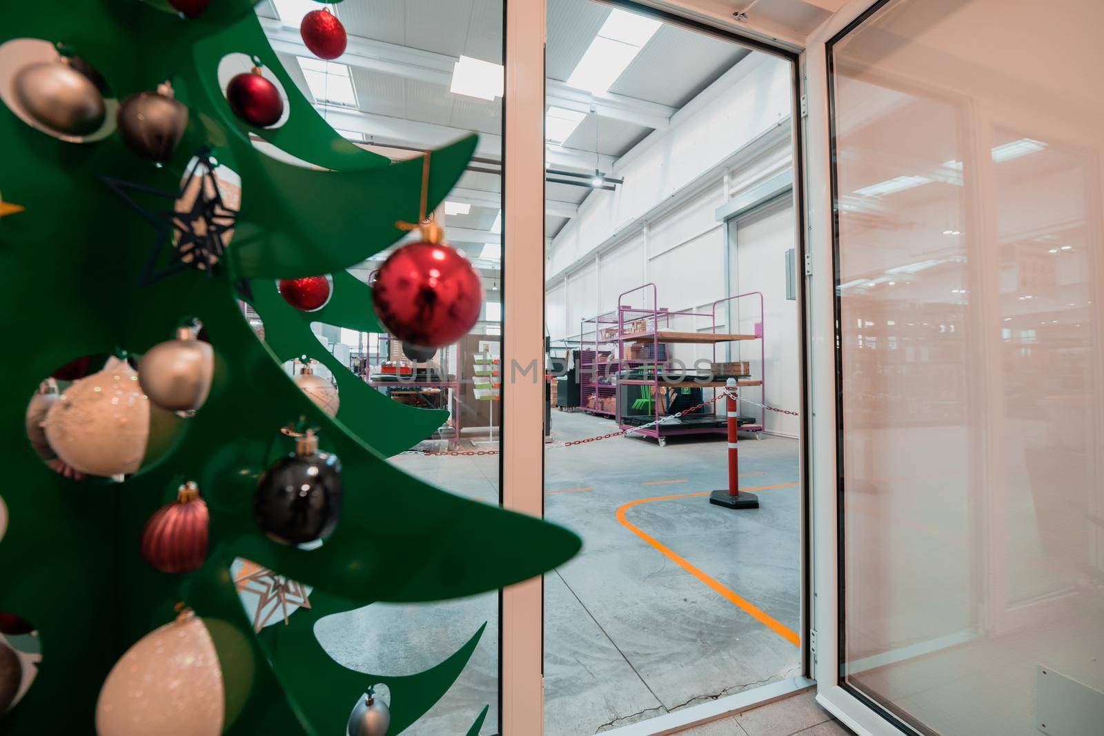 Christmas tree with a garland in the office. High quality photo