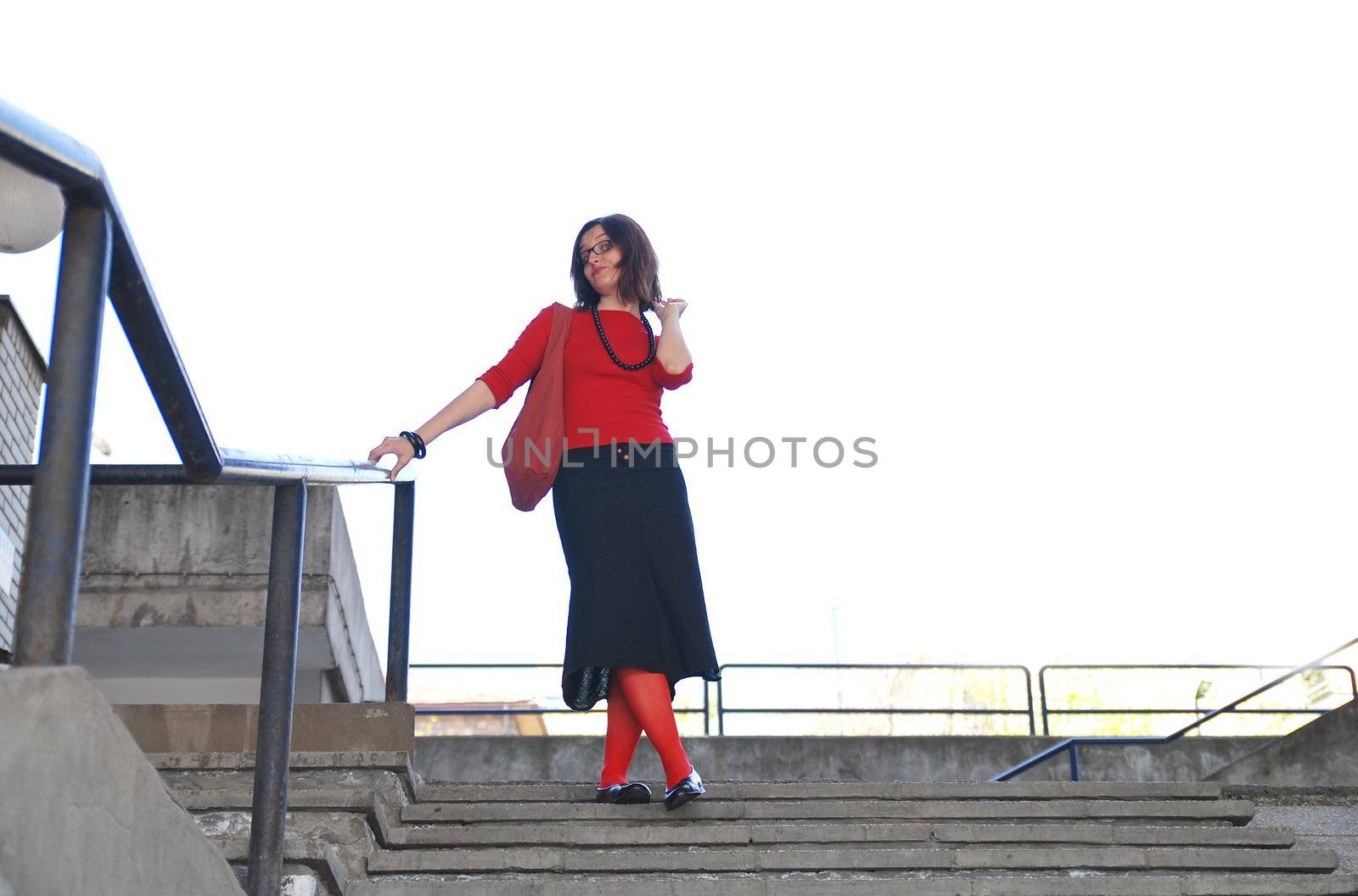 girl with red sox posing on stairs 