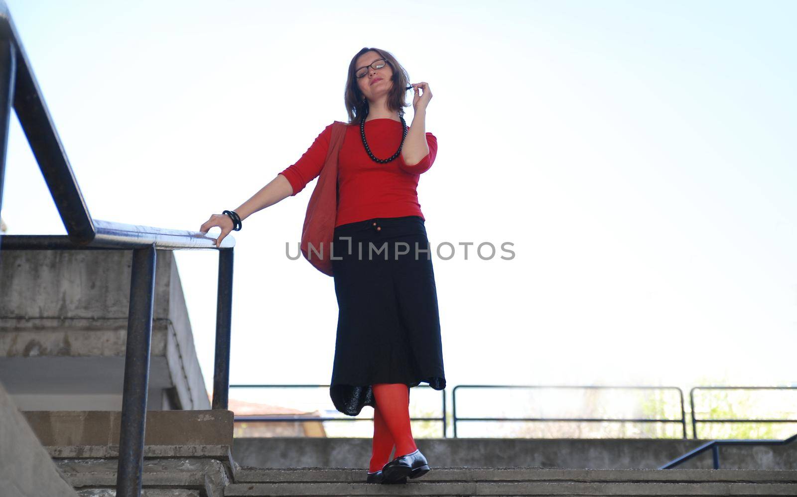 girl with red sox posing on stairs 